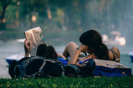 couple planning trip with a map.png
