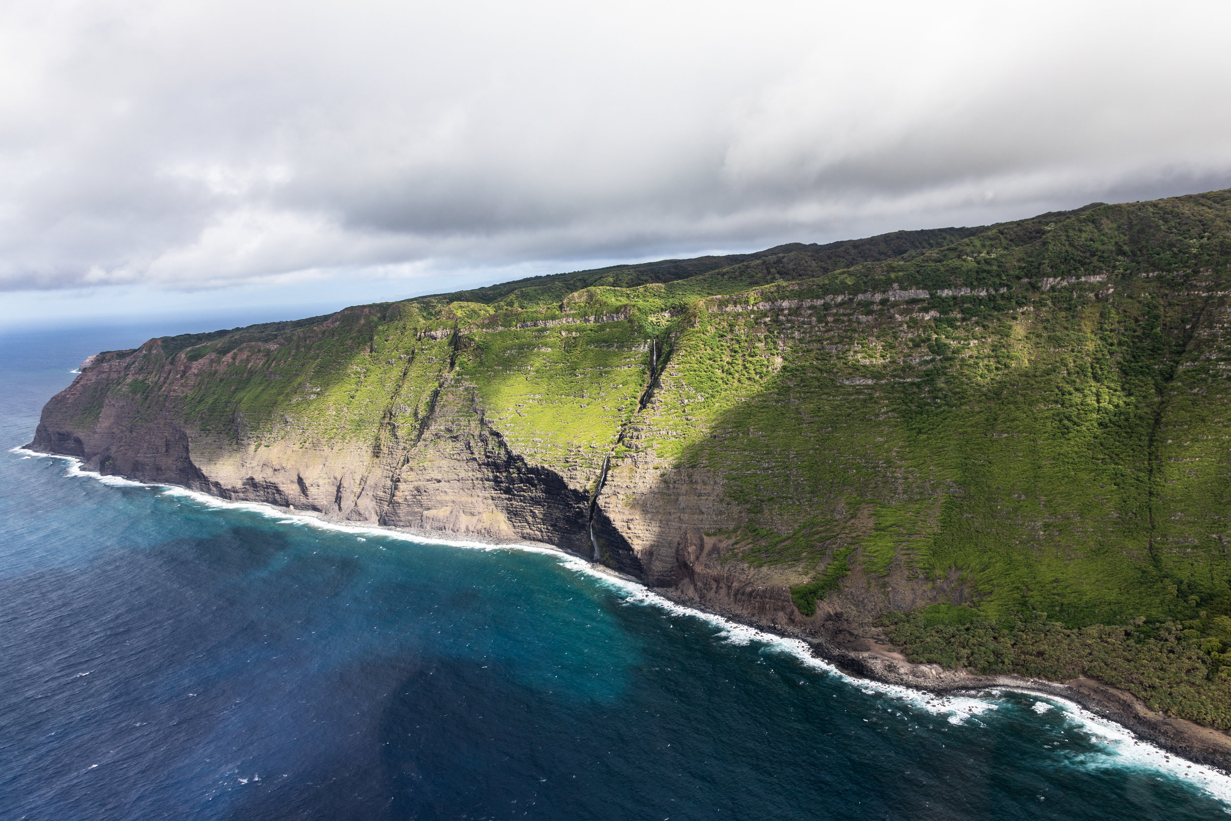  Helicopter view of the beginning of the west cliffs of Molokai, Hawaii. 