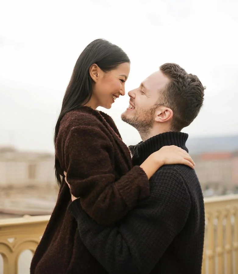a couples smiling at each other
