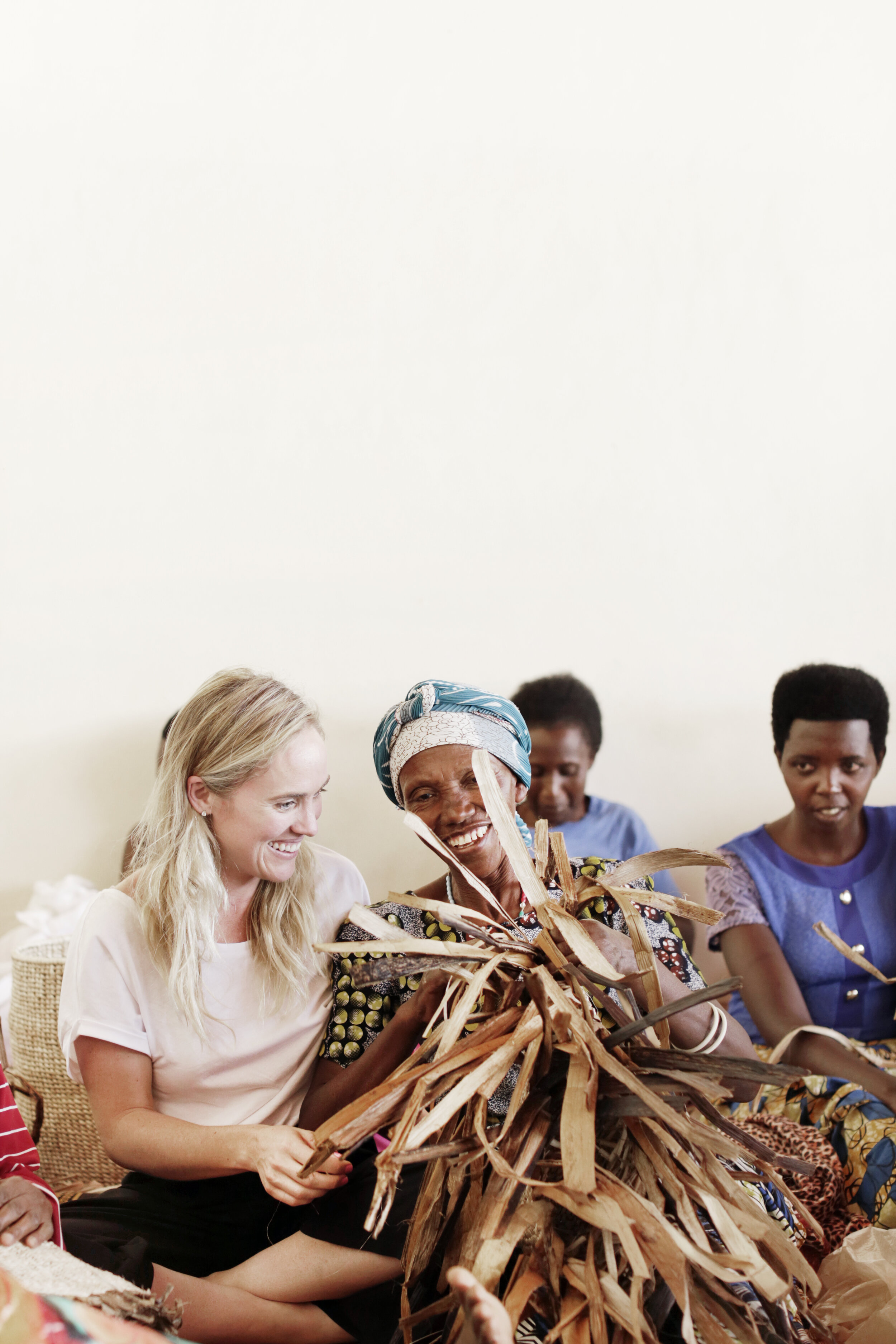  Vocational Training students weaving a basket at Josepha Cooperative in Rwanda. 