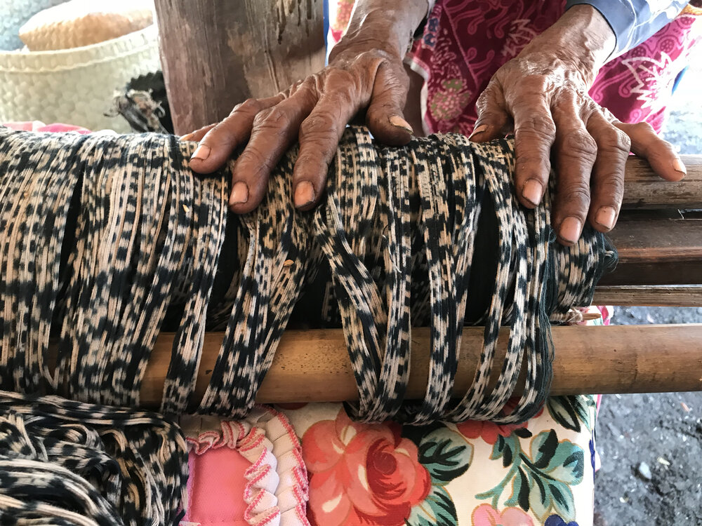 Ikat threads tyed and dyed ready on a backstrap loom stored until the weaver has time to sit down and weave.jpg