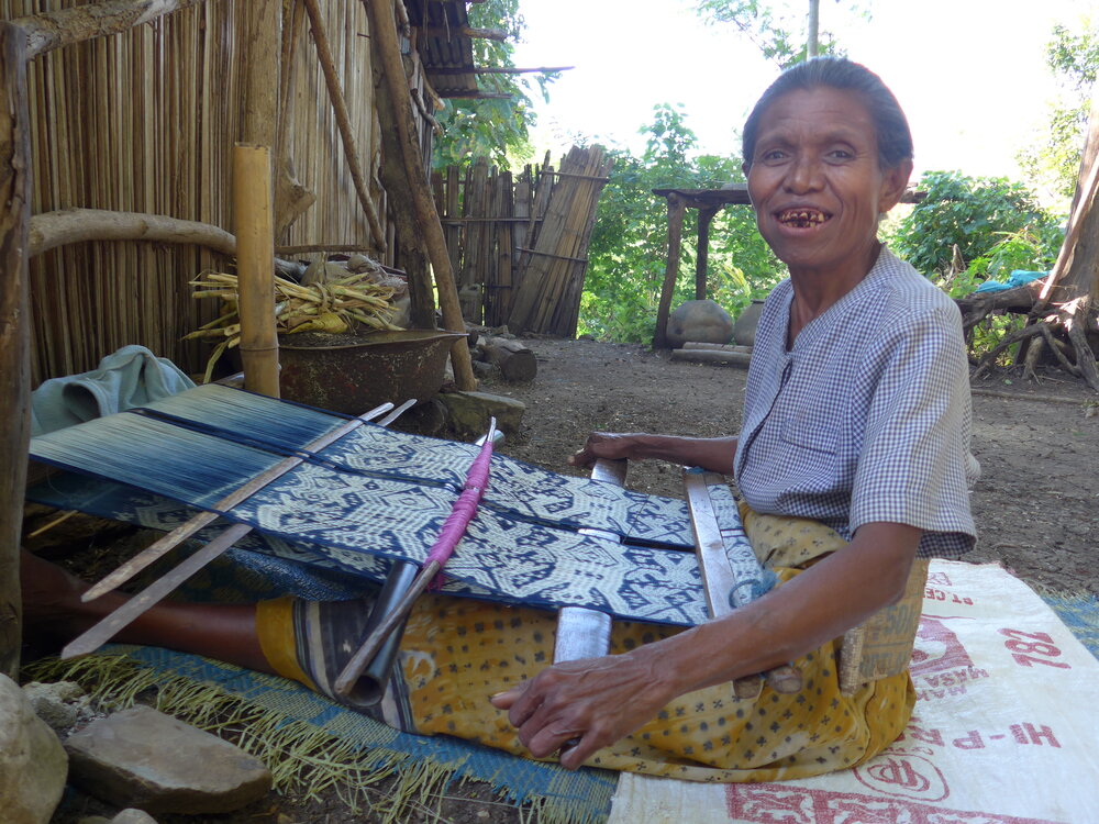 Working on. a backstrap loom in Timor.JPG
