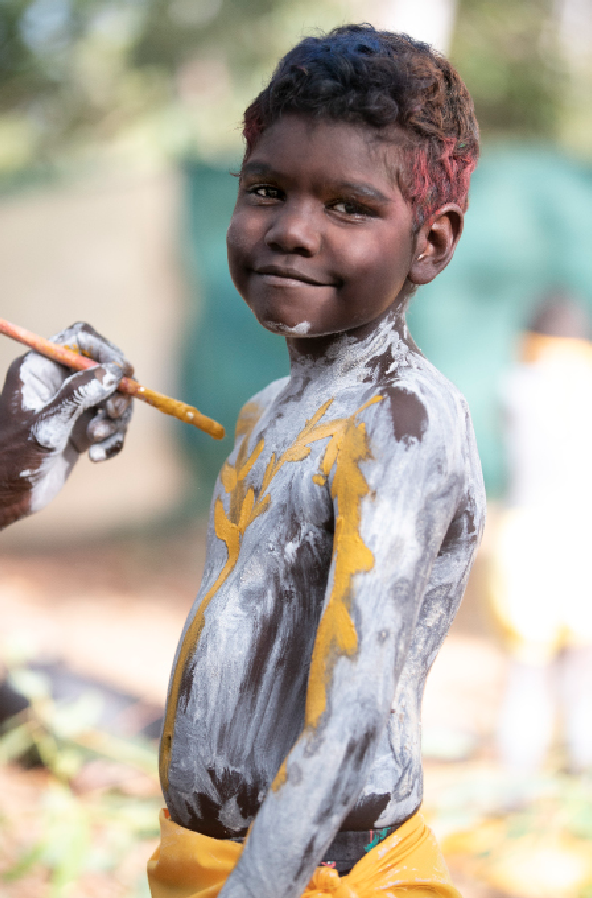 A Gumatj boy painting up for the daily  bunggul&nbsp;  (traditional dance). Photo by Peter Eve. 