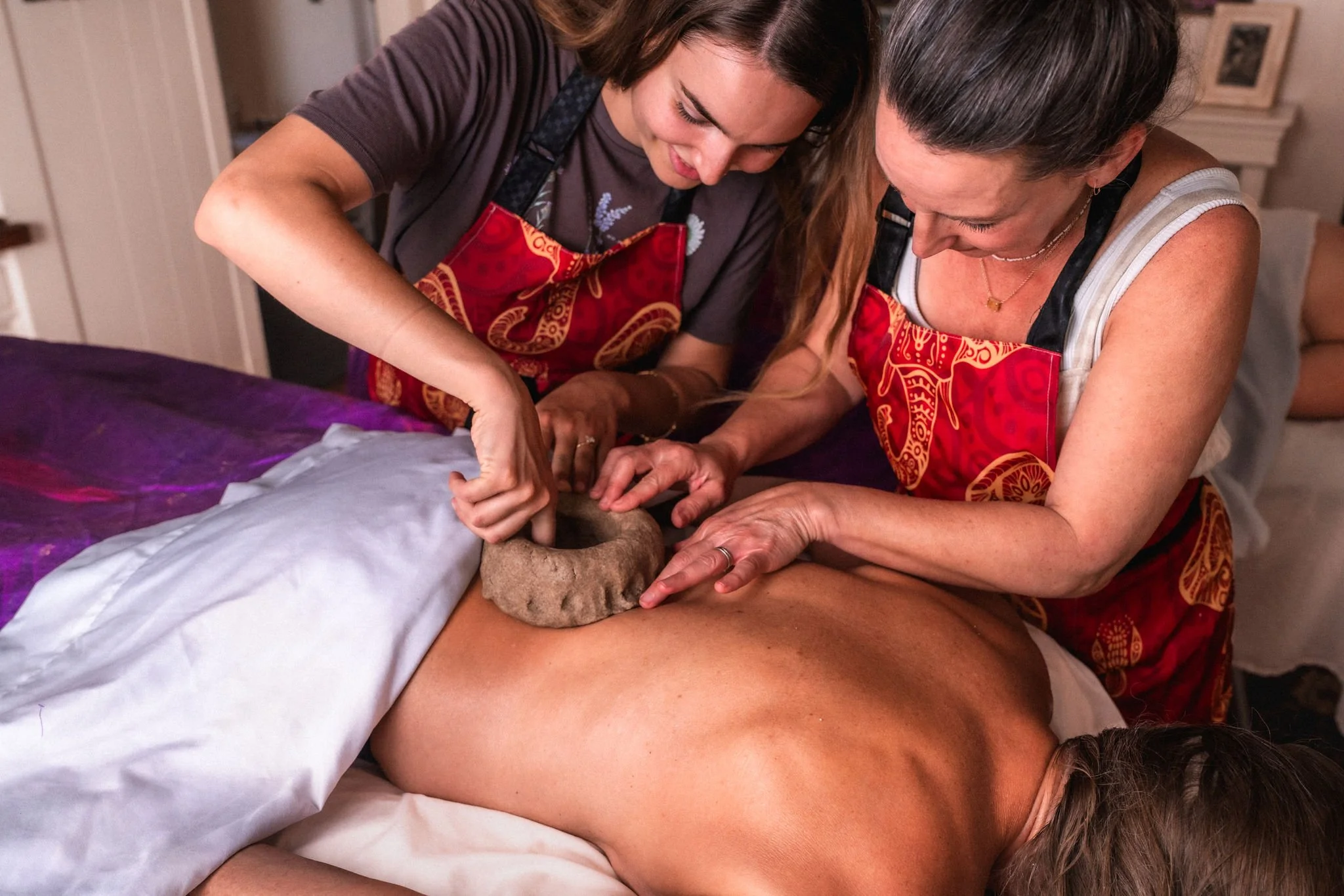 Students practicing traditional Ayurvedic Bodywork during immersive hands-on training at Maharani Academy in Santa Barbara.