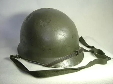 Type 66 Steel Helmet: The first domestically produced combat helmet of post war Japan. Based off American M1 helmet shells with a liner designed for Japanese heads. Early models used IJA Type chinstraps and later models where retrofitted or came with a two point chinstrap. While no longer used for front line combat troops, Type 66 Helmets can still be seen in use with Reservist and rear echelon troops.