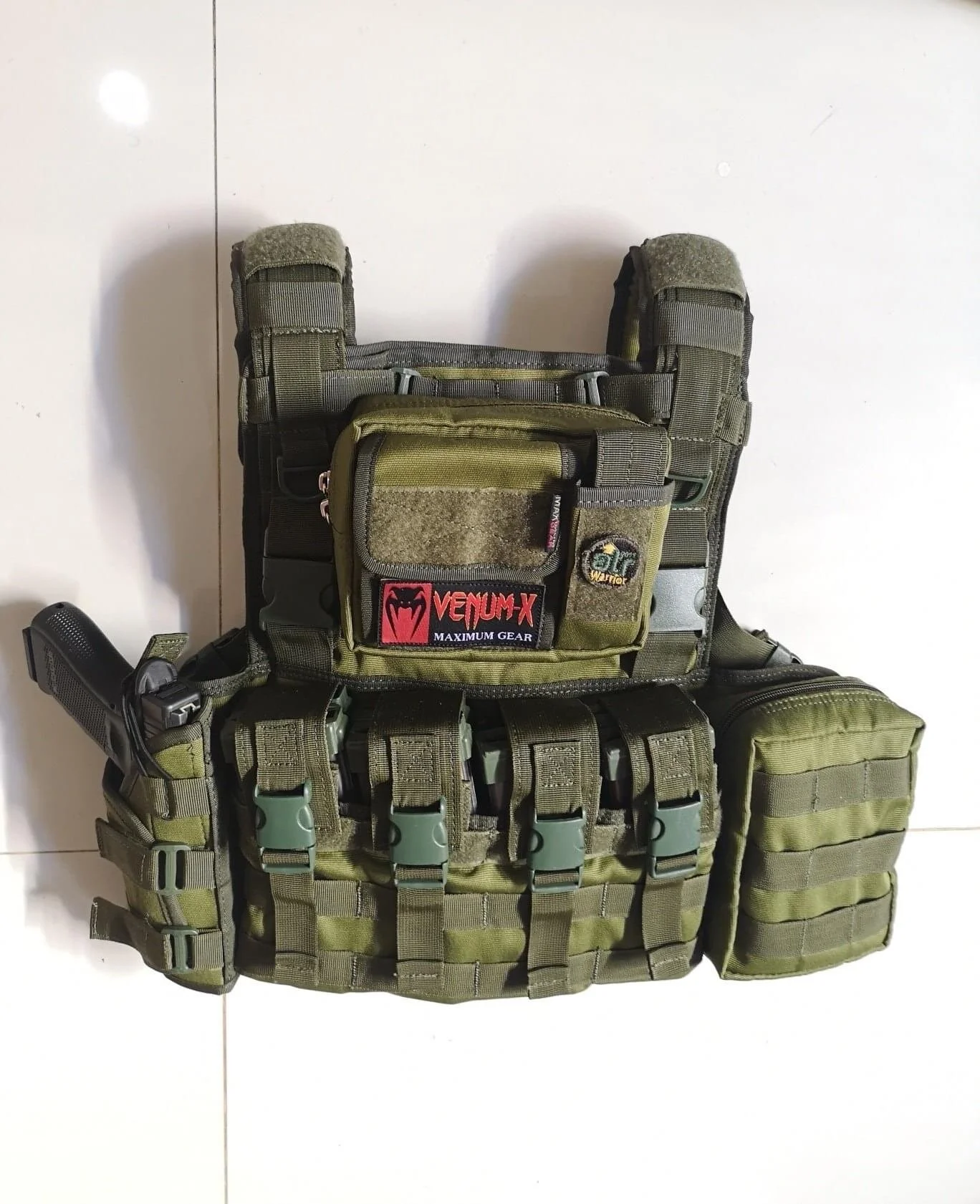 Venum H-Back in OD green. Note the Venum-X PVC patch and newer full mold buckles. This H-Back variant has a pistol holster, a feature seen on previous Venum gear iterations.