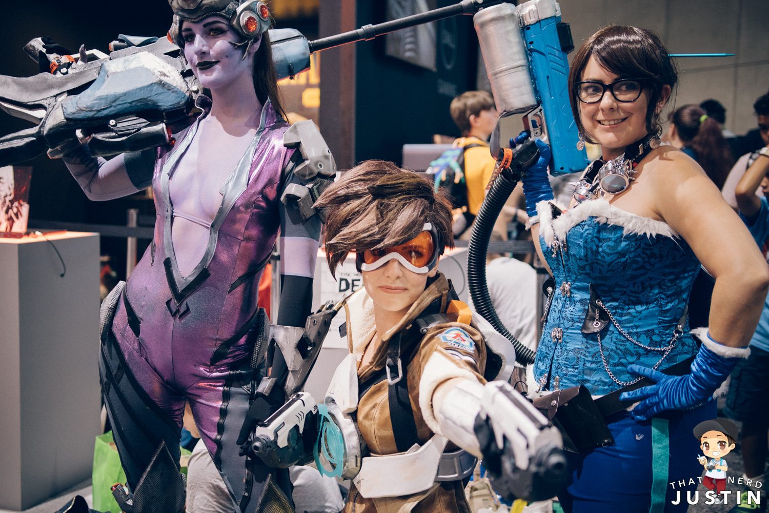 Widowmaker, Tracer, and Mei cosplayers near the Blizzard booth.