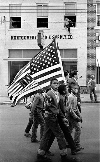 Photo: "Young Civil Rights Marchers in Montgomery March With American Flags" by Stephen Somerstein.