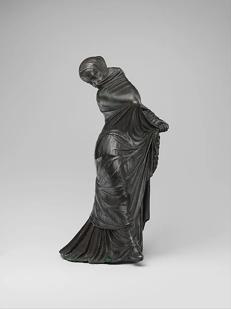 Bronze statuette of a veiled and masked dancer, Metropolitan Museum of Art