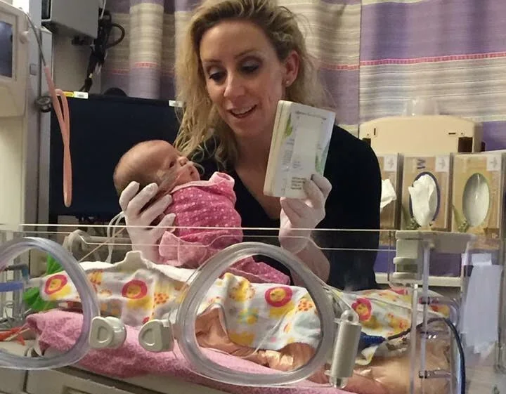 NICU Nurse Reading to Preemie.jpg