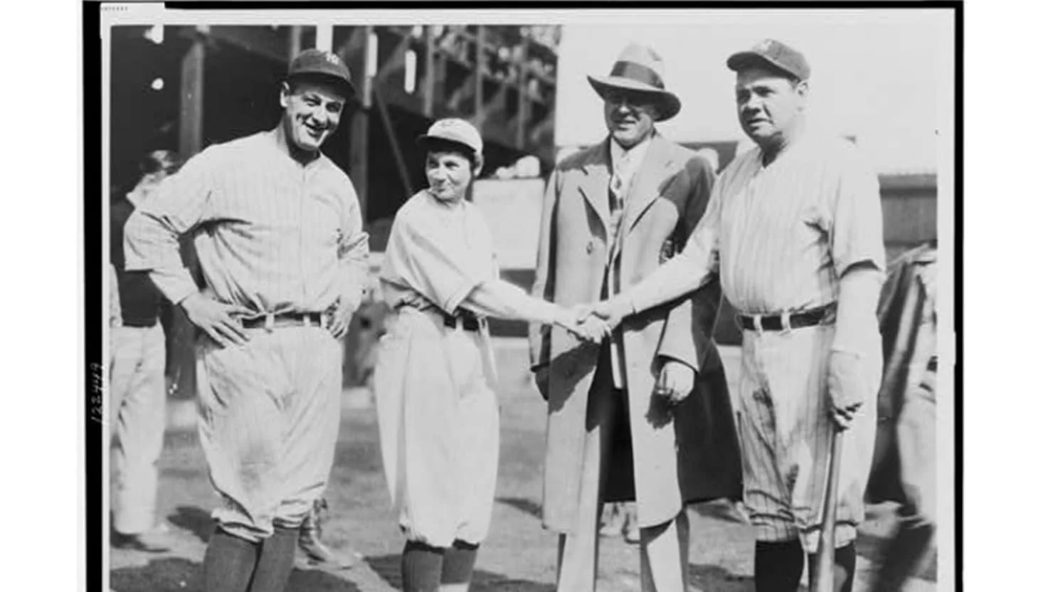 Pitcher Jackie Mitchell shaking hands with Babe Ruth, while Lou Gehrig (left) and Joe Engel stand by, 1931 (Library of Congress)