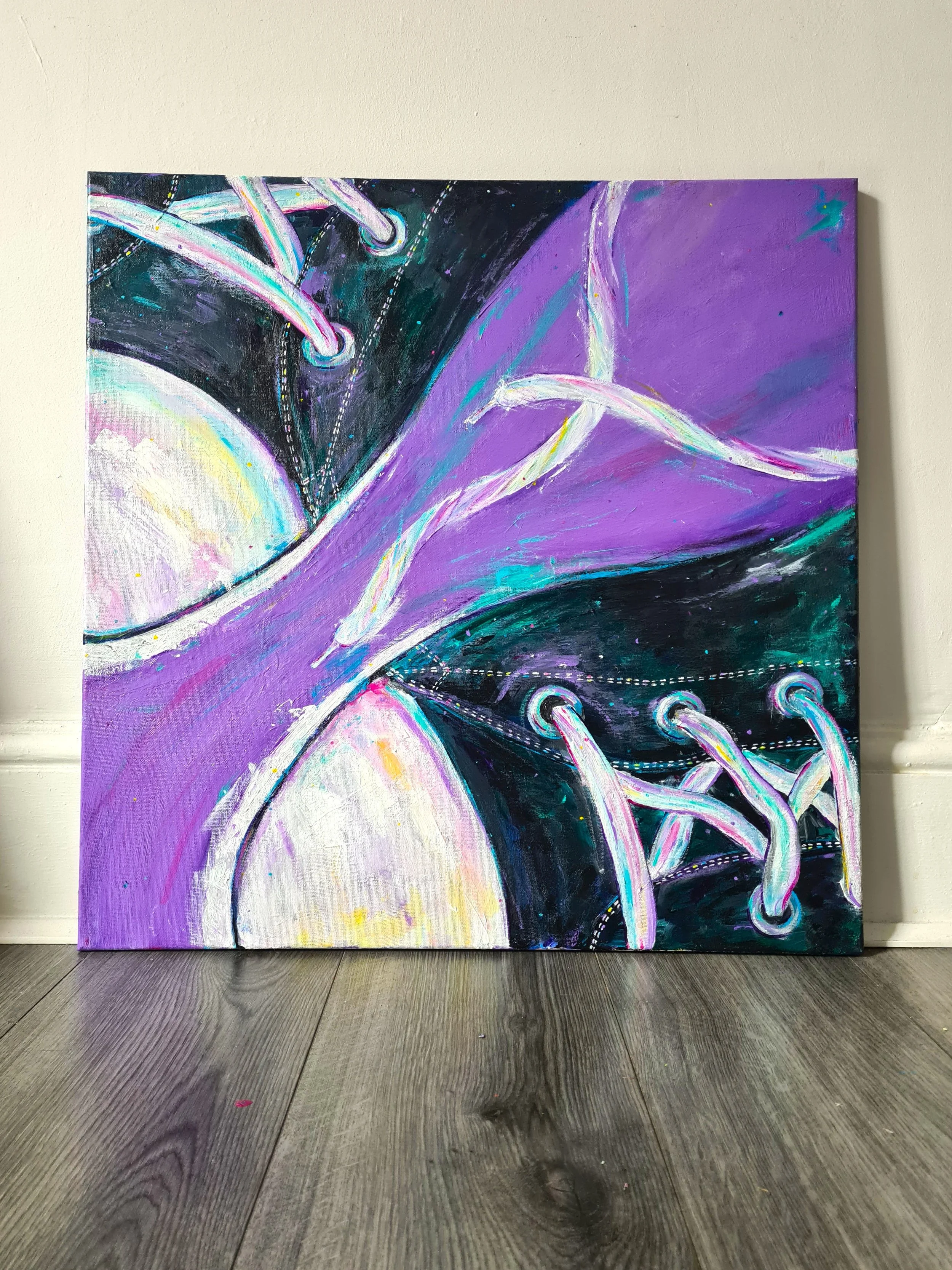 painting of black converse trainers