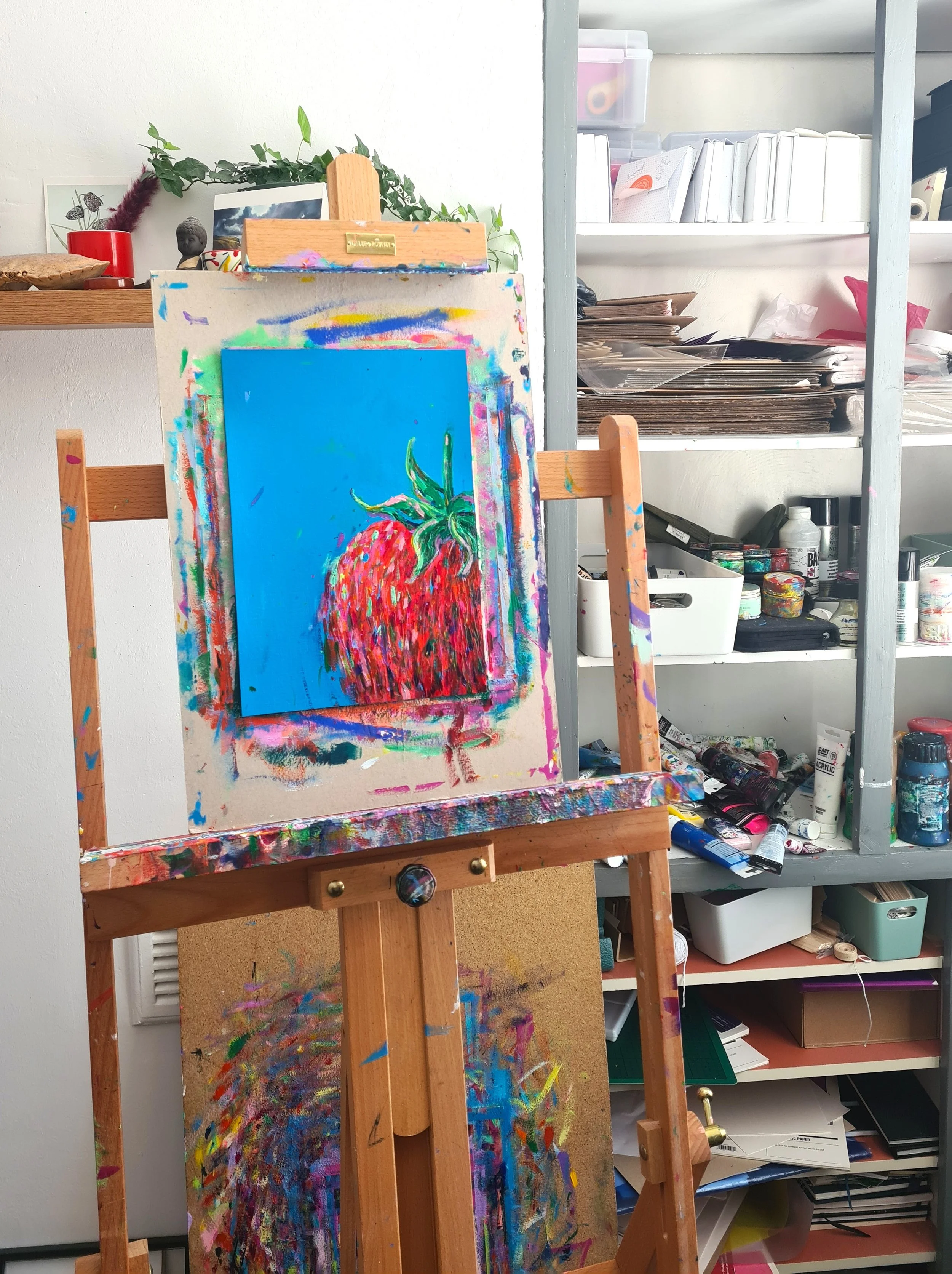 painting on an easel in an artists studio
