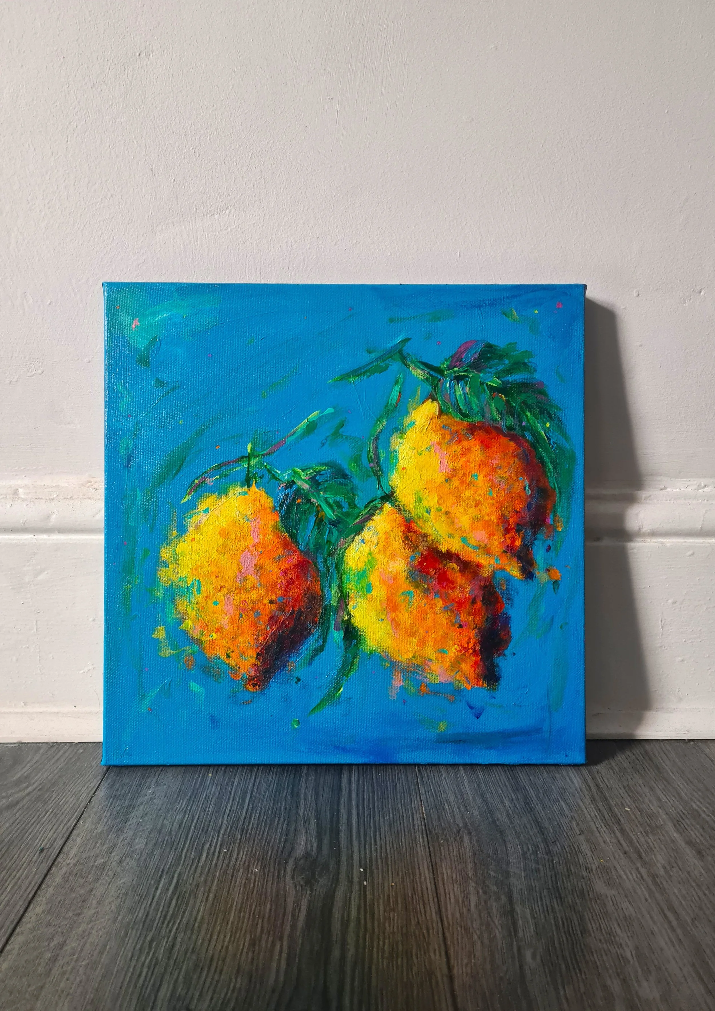 square painting against a white wall