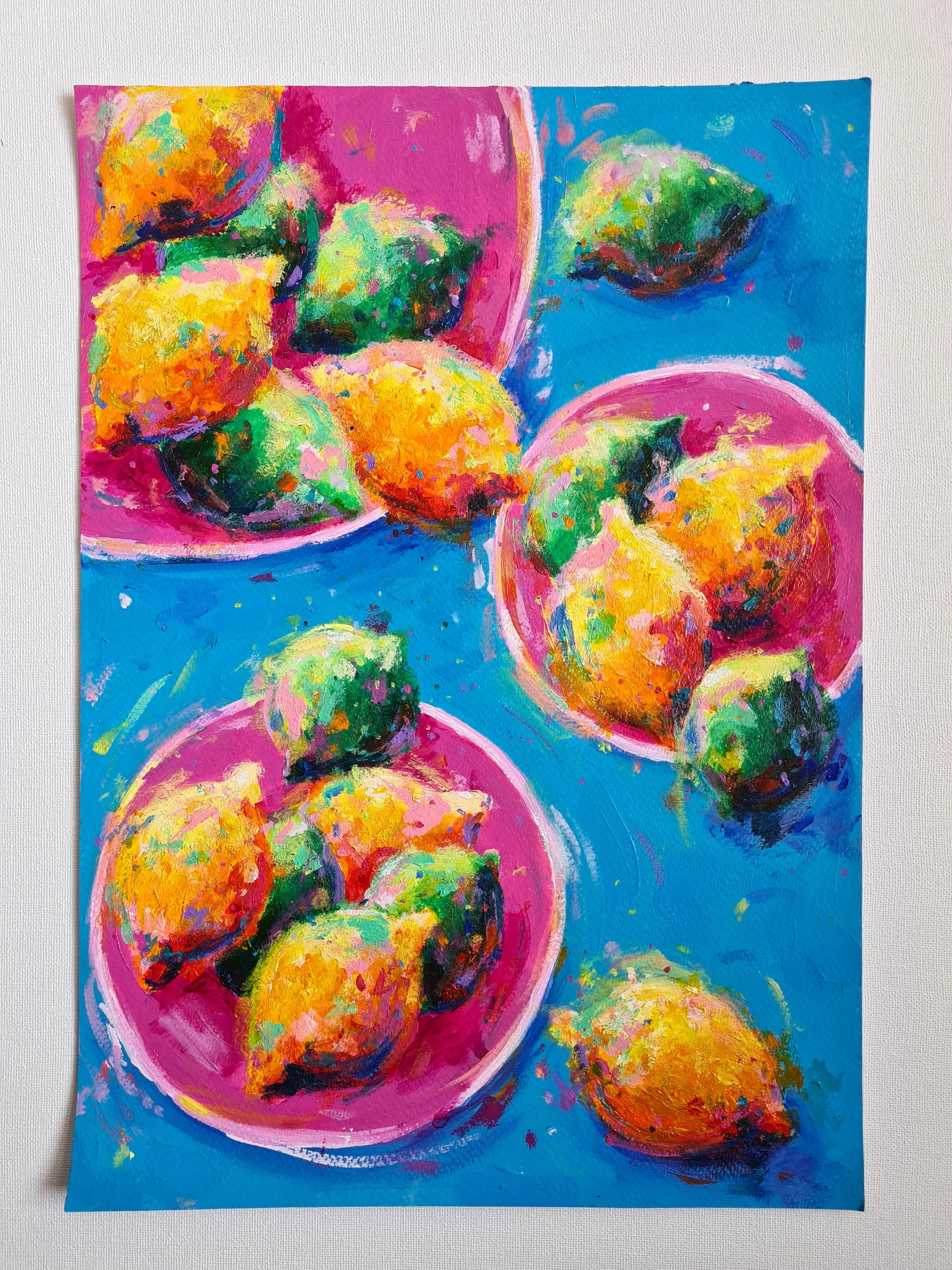 lemons and limes on pink plates