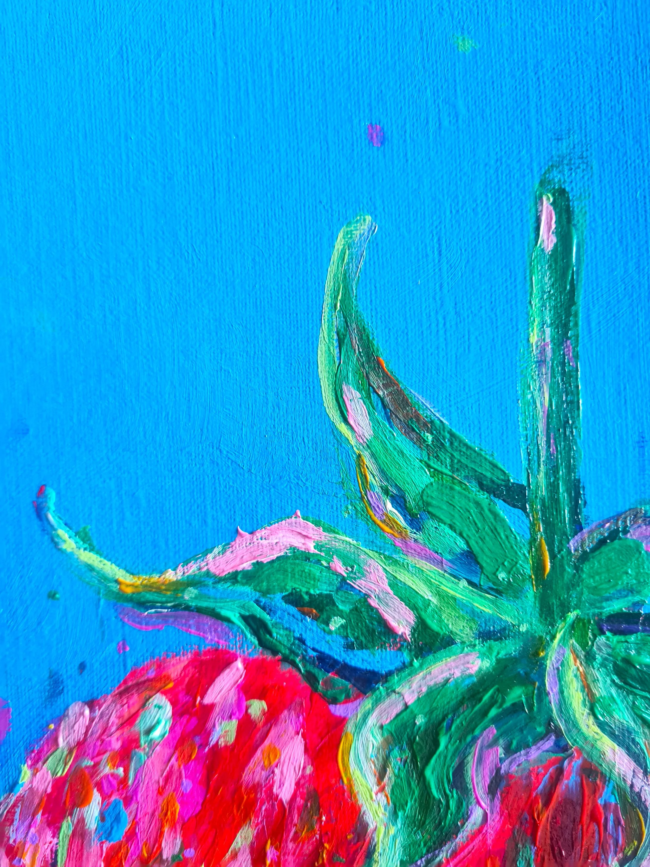 close up of a green strawberry stalk