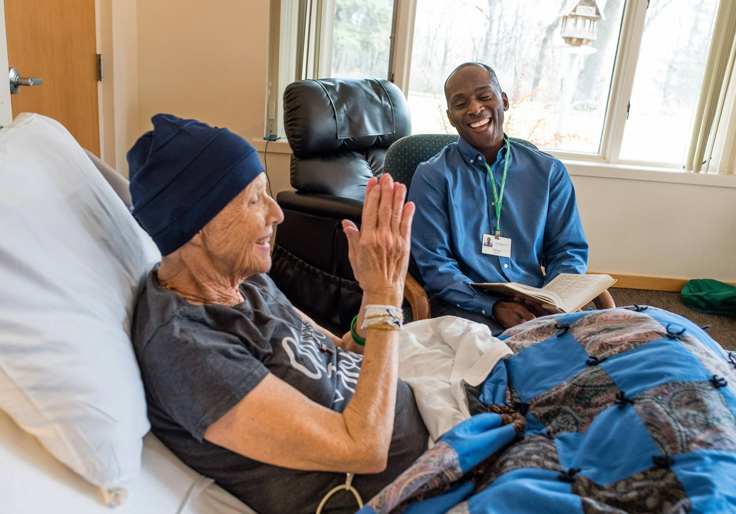 13. Anthony with patient - Creighton U article - crop2.jpeg