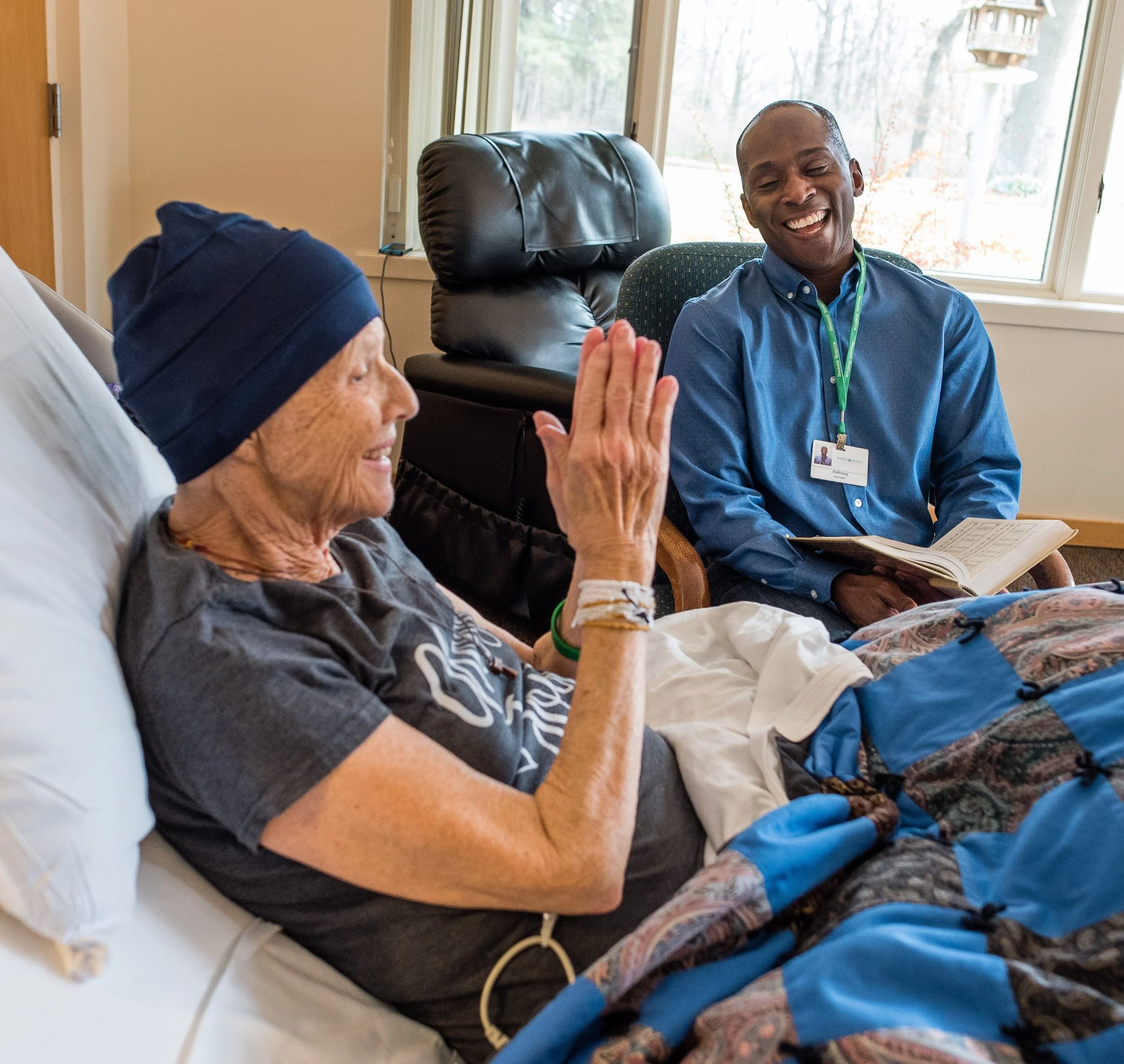 Anthony with patient - cropped - Creighton article.jpeg