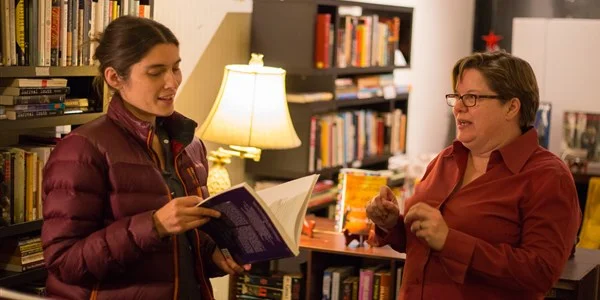 Jamie Harker (right) with a customer at Violet Valley Bookstore in Water Valley, Mississippi, on Dec. 1, 2017. Kevin Cozart / (From NBCNews.com)