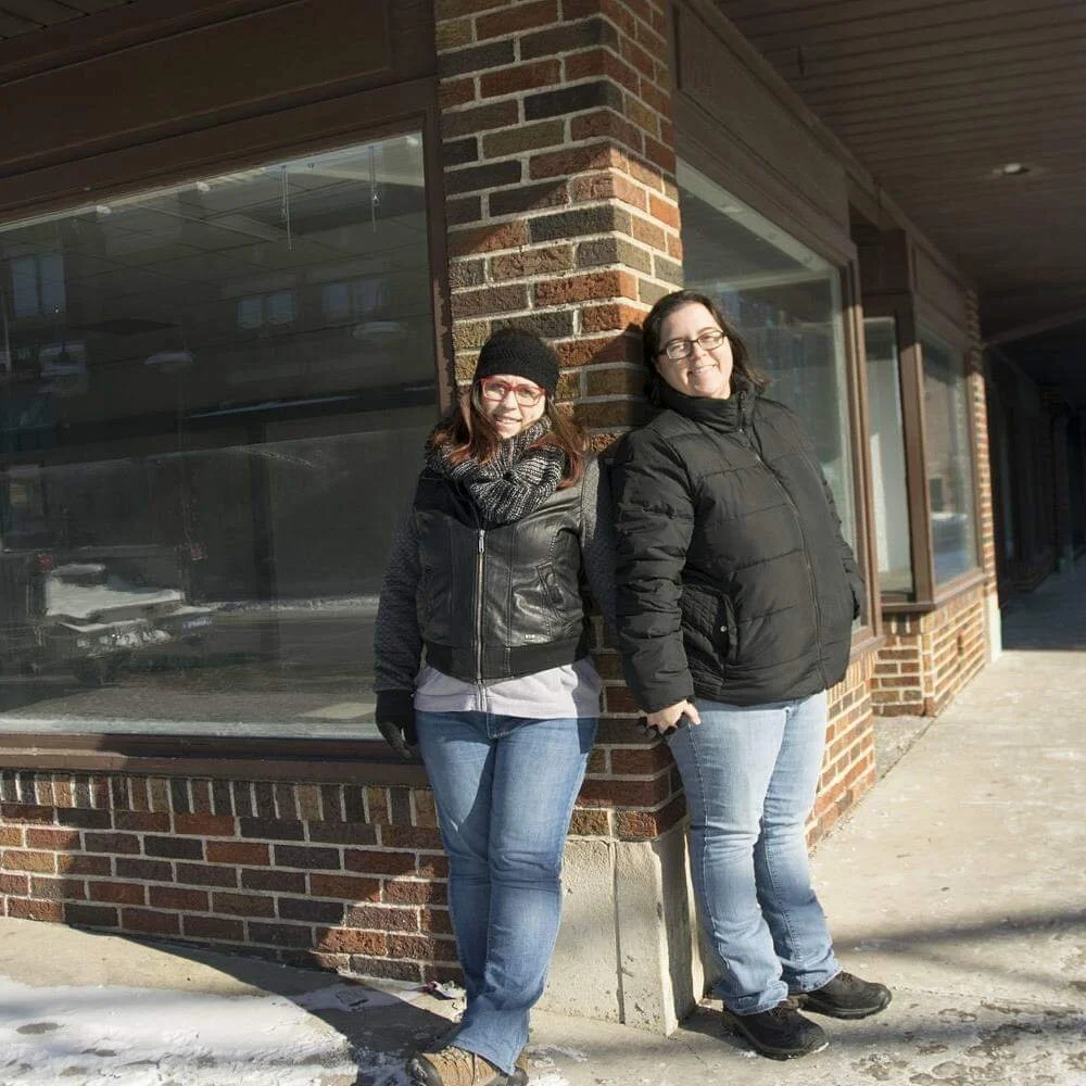 Cheri and I posing in front of our new place the day after signing the lease in December 2017.