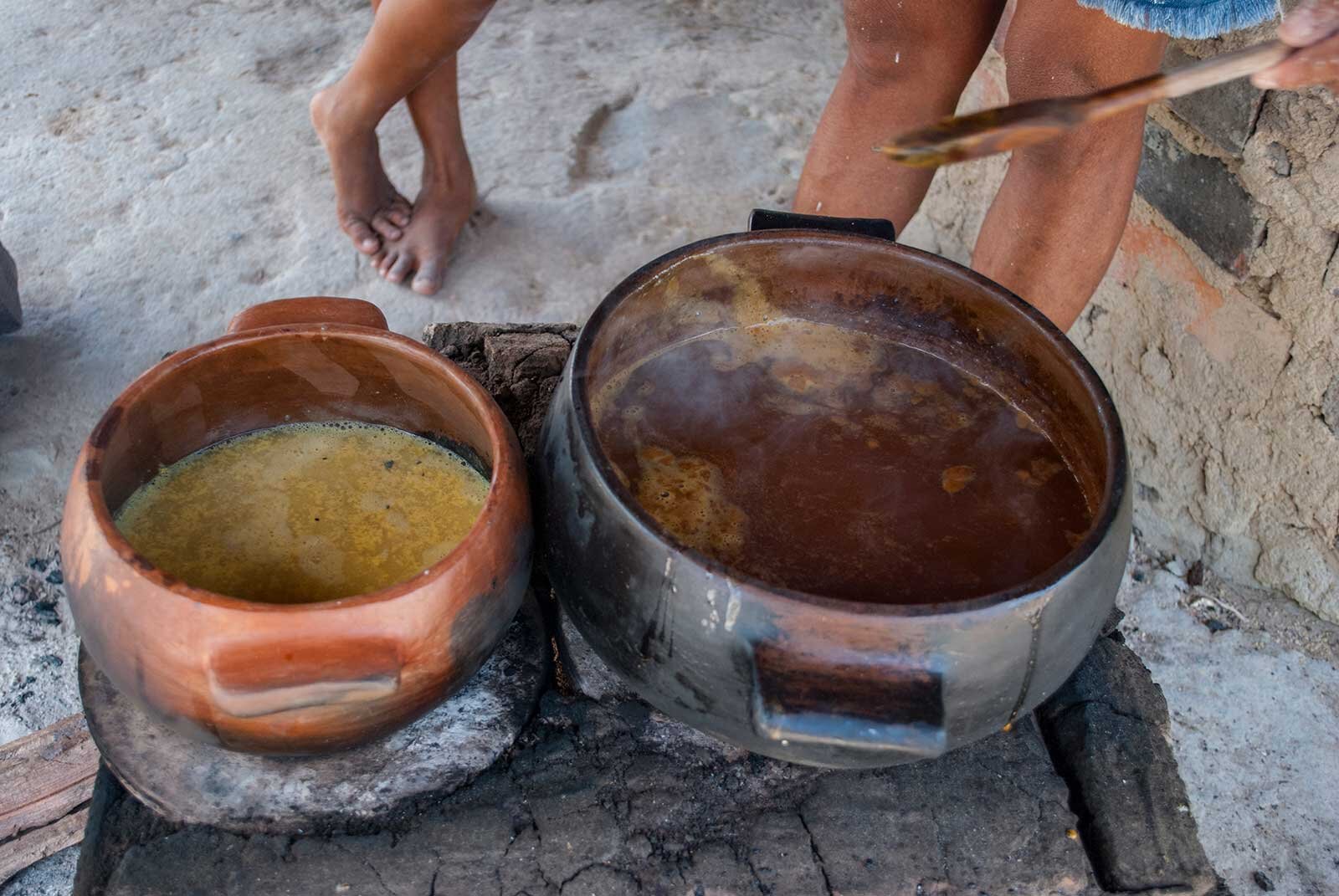 Here they make the black tucupi in clay pots. Tourists can come and try it during an annual festival (Festival das Panelas de Barro) where visitors camp for three days, hiking, swimming and learning about traditional pottery techniques. Photo © Tin