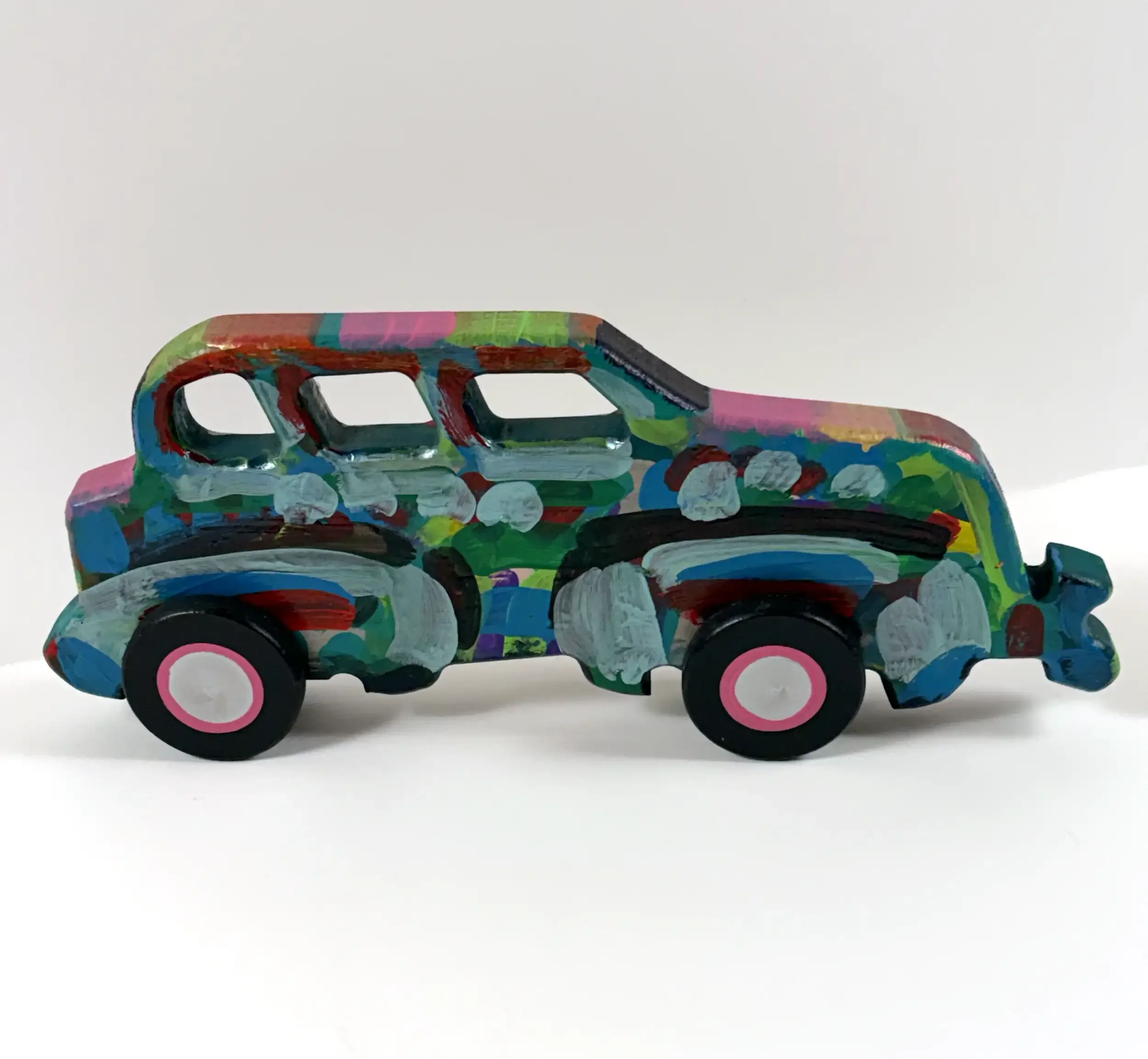 frank-romero-carved-car-side-2.webp
