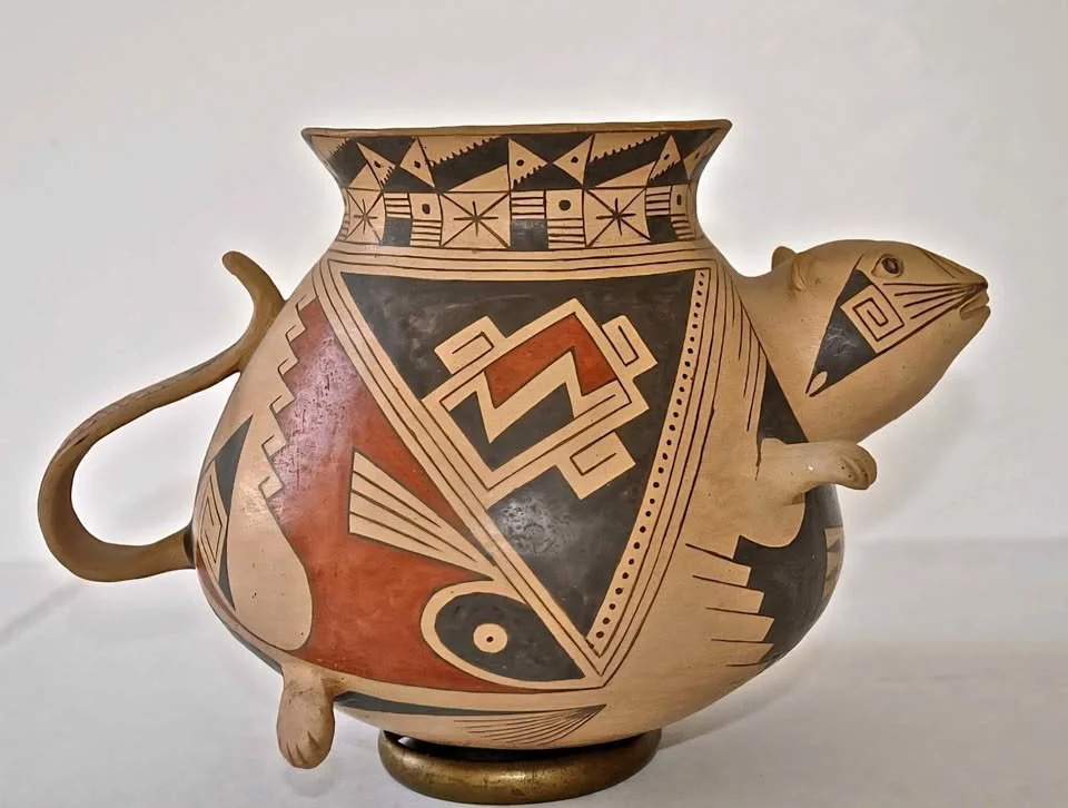 Polychrome Mata Ortiz effigy olla by Juan Quezada, shaped as a stylized mouse with black, red, and cream geometric painted designs.