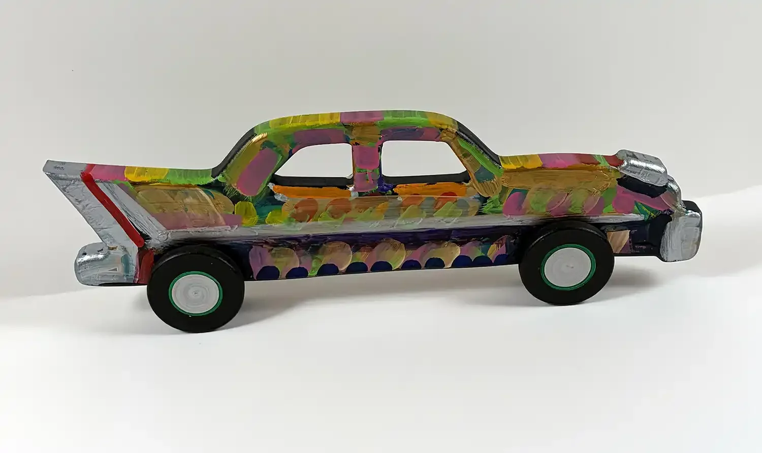 Reverse sideHand-carved two window  car frank Romero