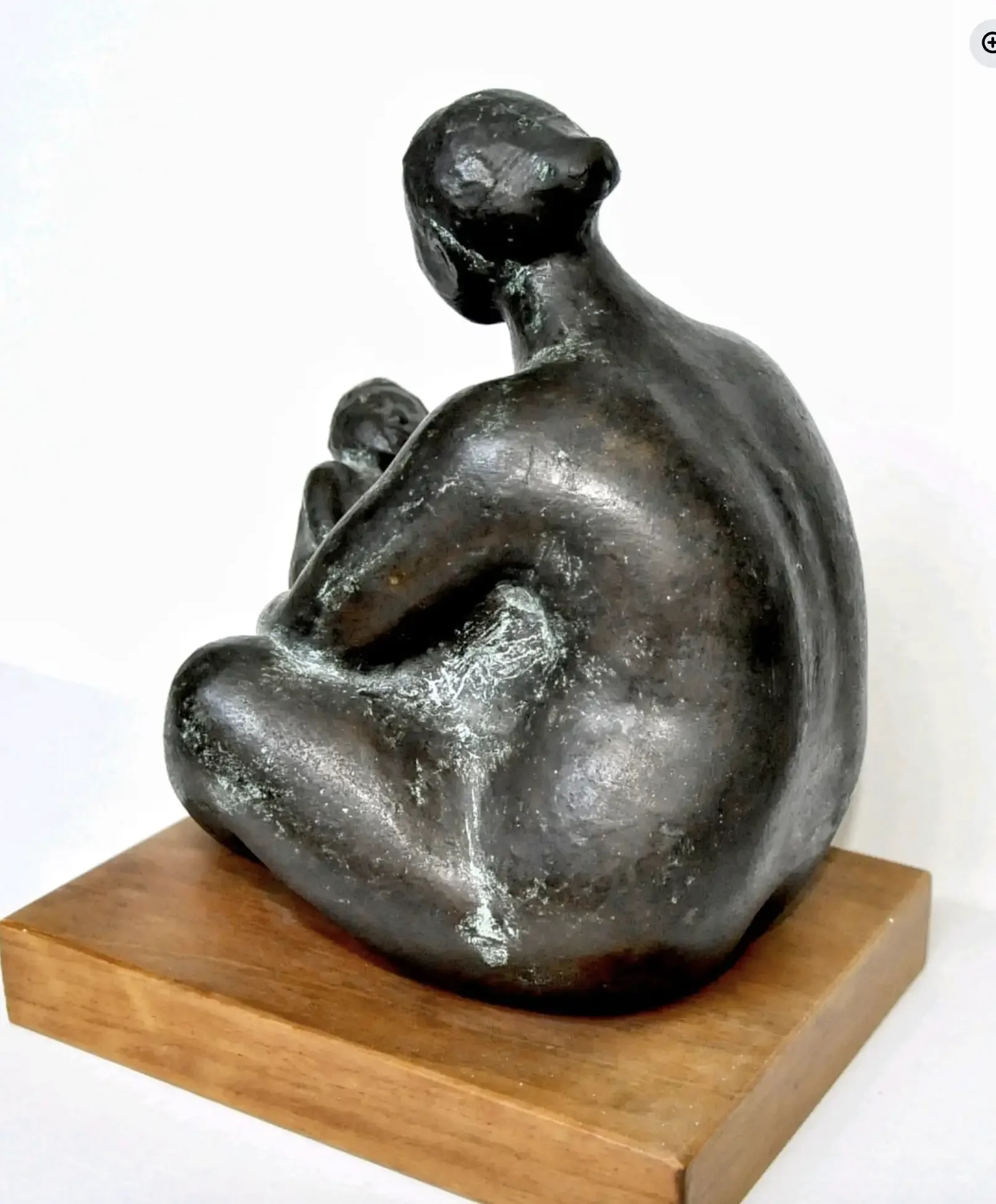 back view of seated female figure sculpture by Jorge Luis Cuevas