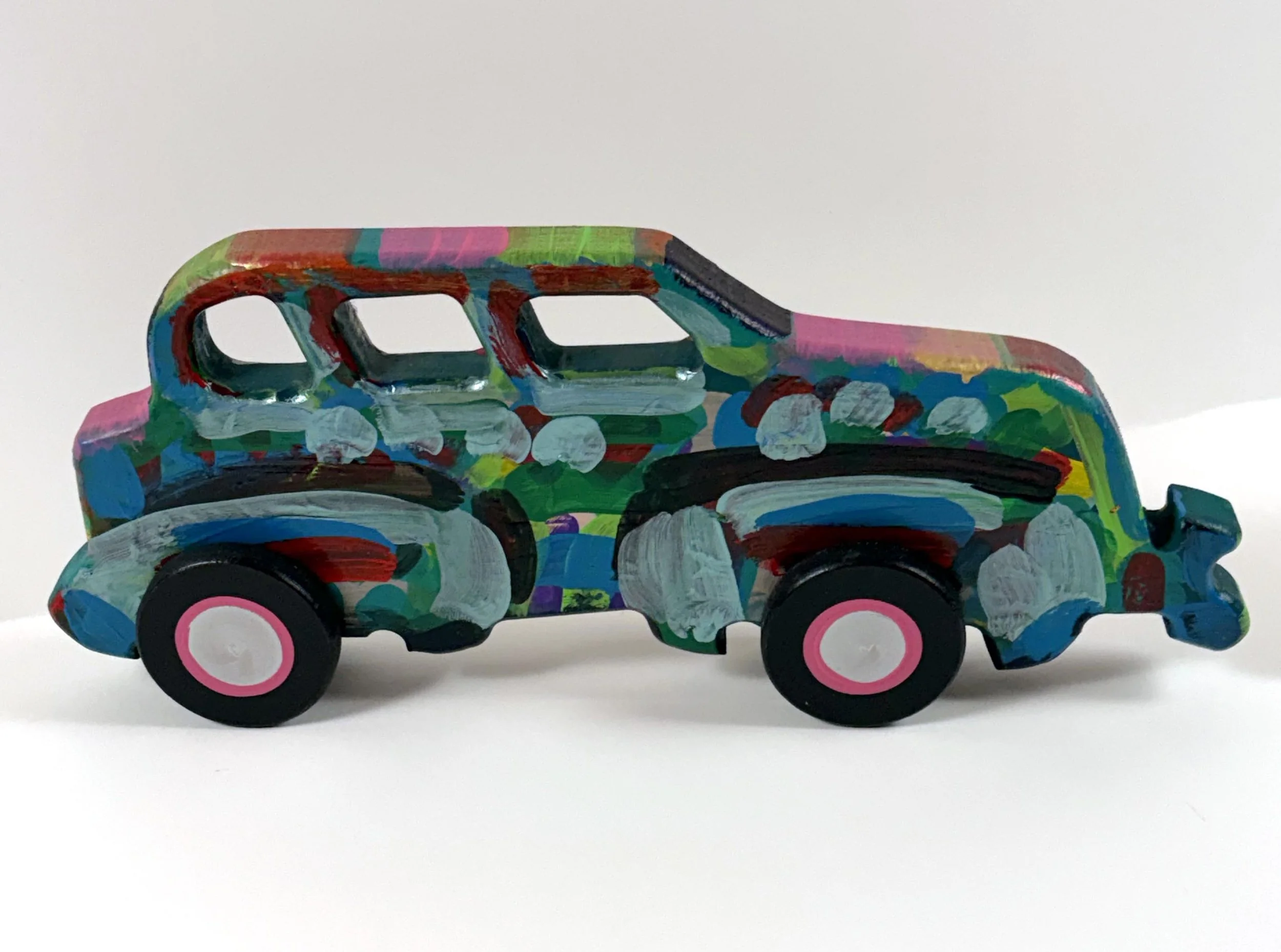 Carved wood car by Frank Romero