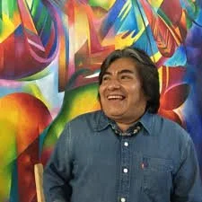 Bernard Modesto in front of painting