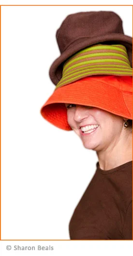 photo of kit morris wearing 3 hats and looking like the cat in the hat character from dr. zeuss