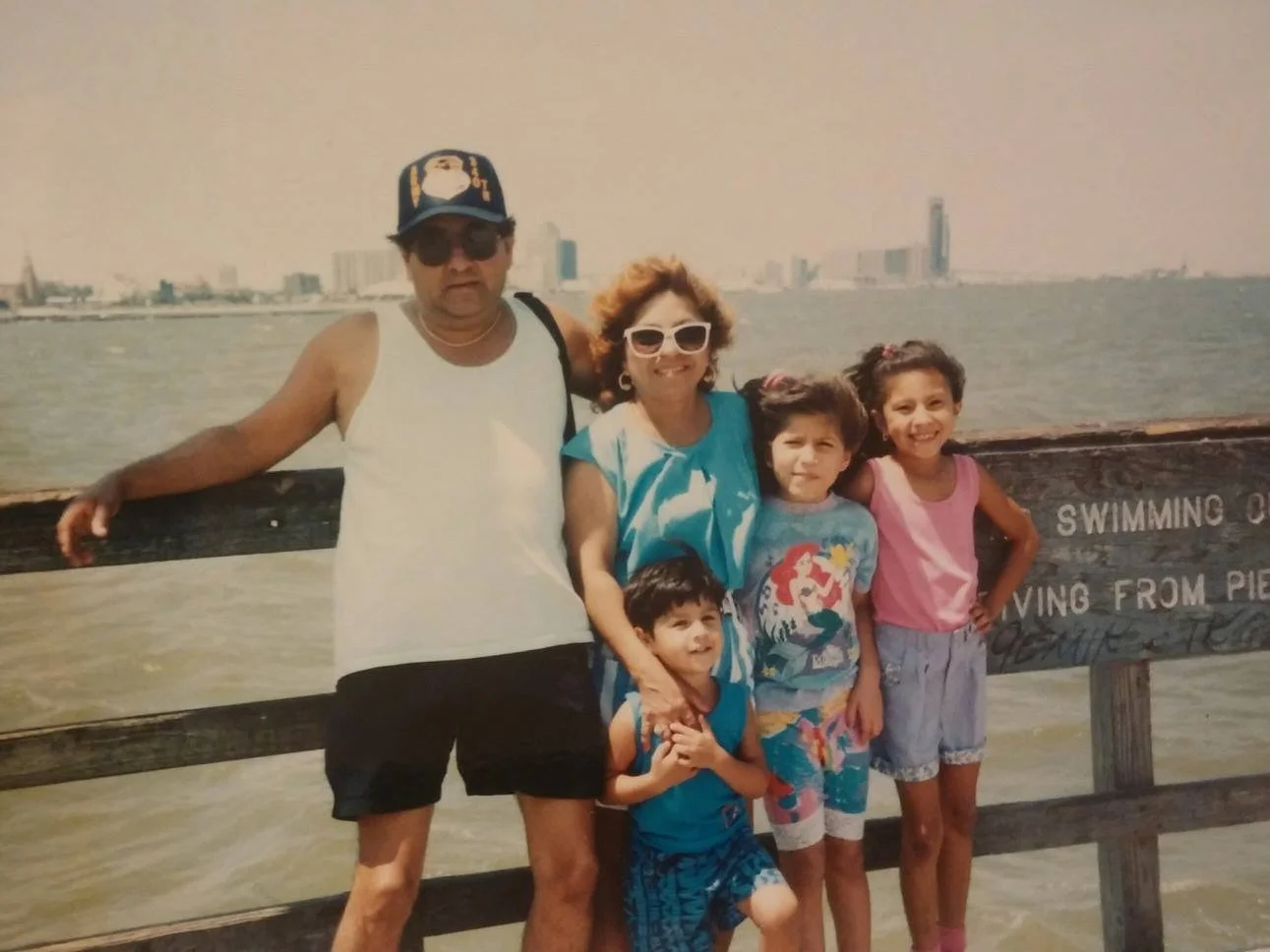 This is my family.

Here you see my grandparents, my brother, and my cousin. Yes, that's little Jessica in the pink shirt to the far right side. I don't remember the year or the exact place, but it was taken in Corpus Christi where we went every summ