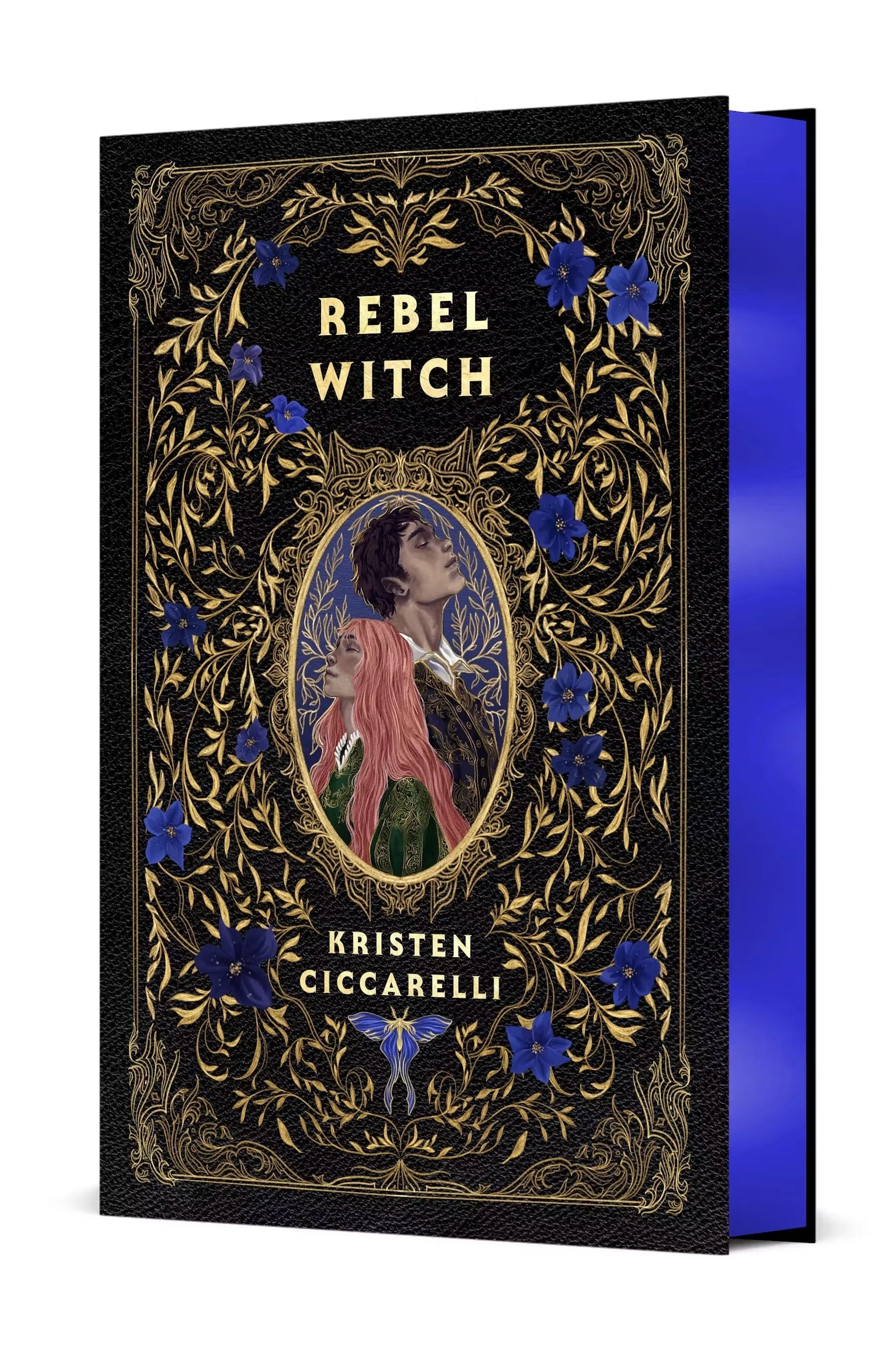 Rebel Witch Collector's Edition by Kristen Ciccarelli, with a black and gold floral cover and blue gilded page edges