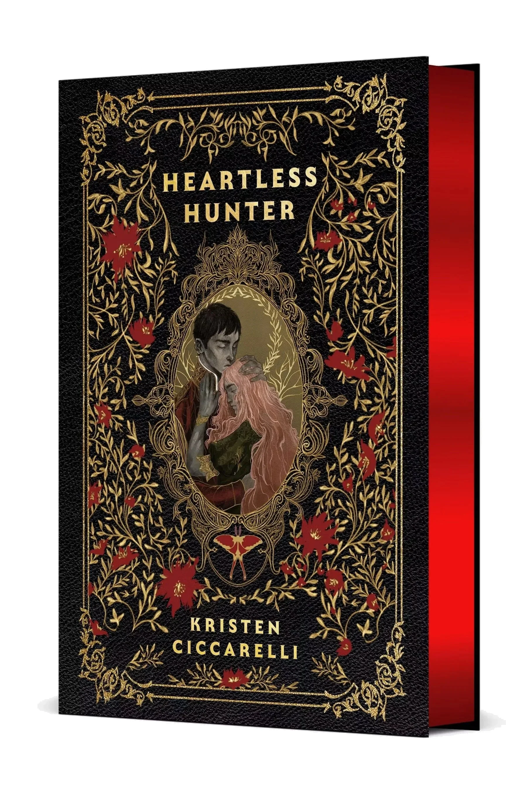 Heartless Hunter Collector's Edition by Kristen Ciccarelli, with a black and gold floral cover and red gilded page edges