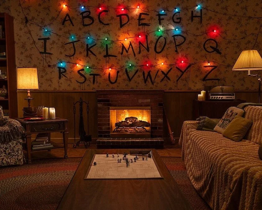 Netflix Just Dropped “Stranger Things”, “Wednesday”, and “KPop Demon Hunters” Yule Logs — And They’re The Coziest Chaos Ever