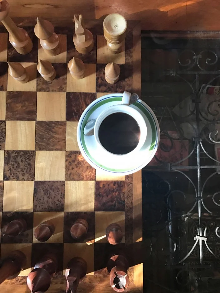 “Taking a break from the sun to have coffee and play chess... I won! Although I lost in Scrabble later that night.”