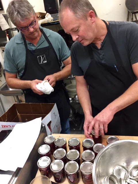 A pair of Pauls prepping the plums (say that five times fast)