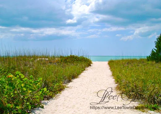 Beautiful nature photography of a path leading to a Gulf of Mexico beach with storm clouds rolling in. This nature photography is available on a variety of print wall art and home decor items through Fine Art America.