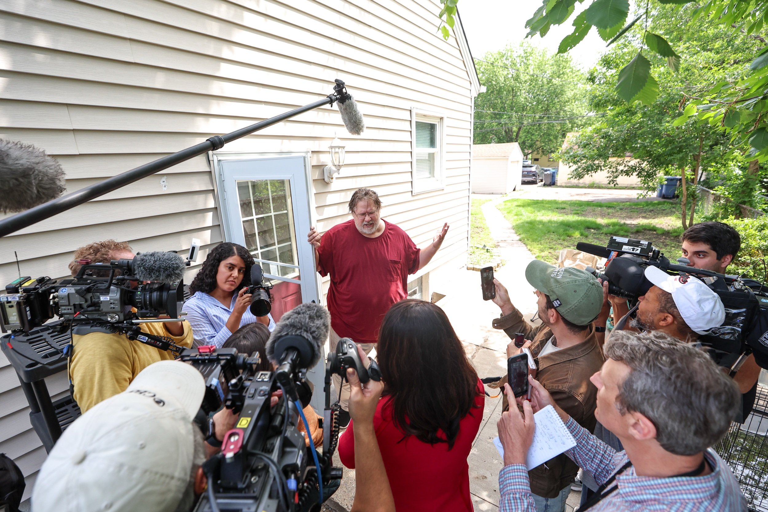 David Carlson, housemate and childhood friend of Vance Boelter, speaks to media outside of the rental house in North Minneapolis on June 15th, 2025 where Boelter stayed on and off for around a year for work outside of his home in Green Isle, MN.