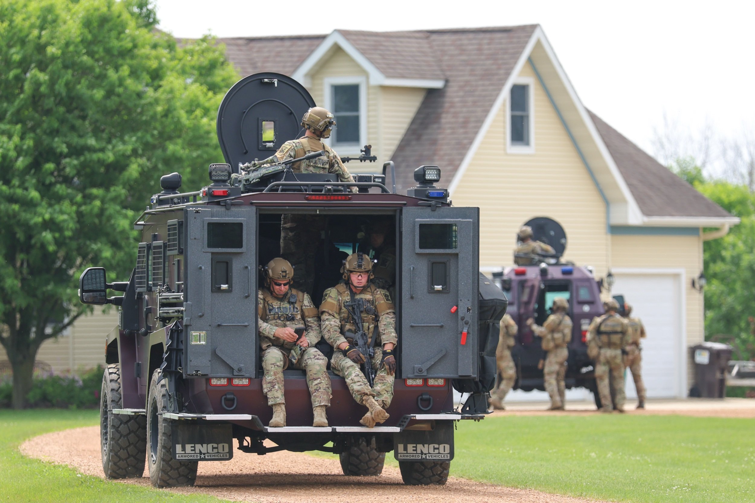 Law enforcement including SWAT from Minnesota State Patrol, Ramsey County, and Sibley County search homes in Sibley County, MN for the suspect in the murders of DFL Rep. Melissa Hortman, Husband Mark Hortman, and the shootings of State Sen. John Hof