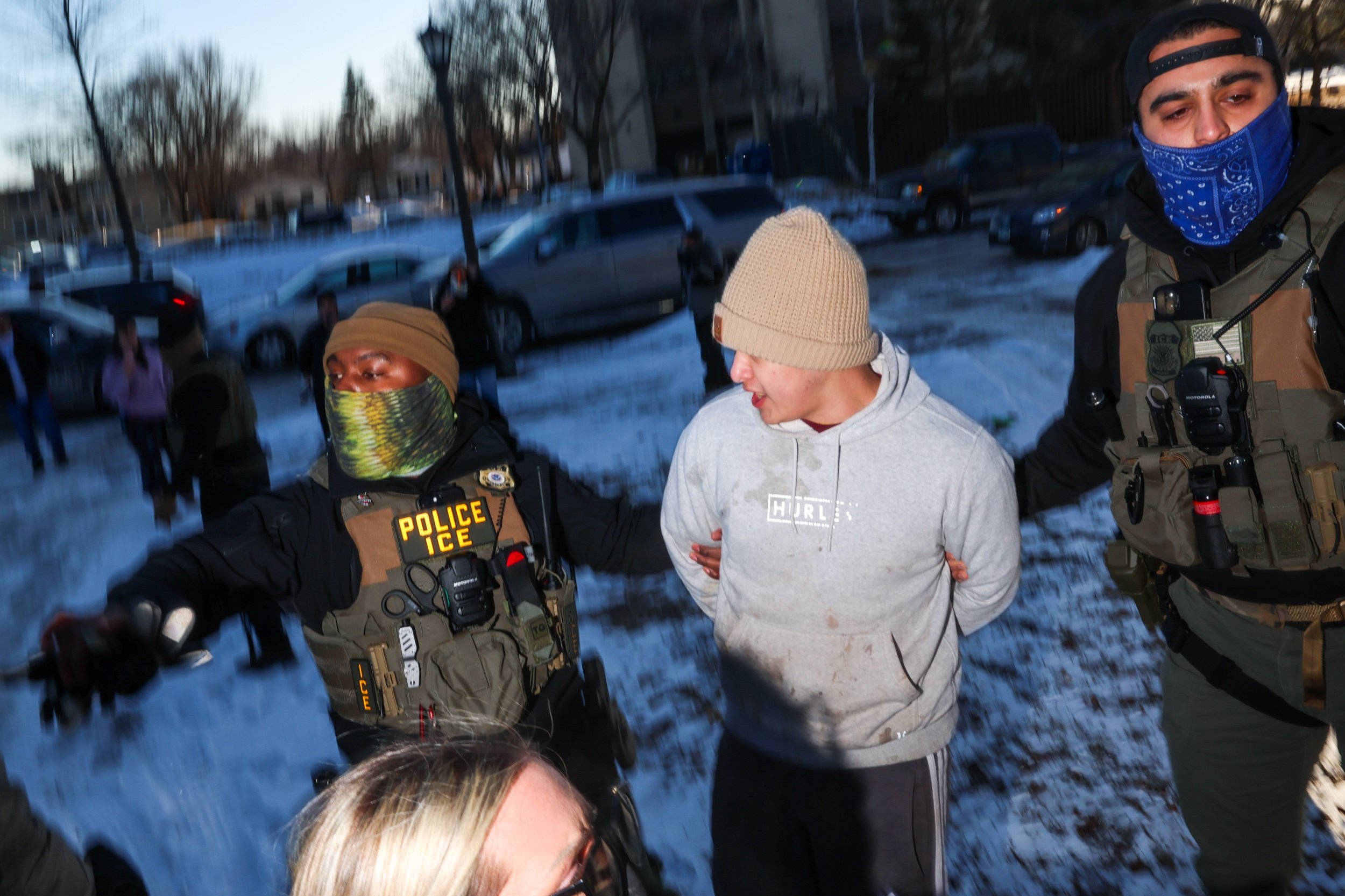  ICE agents detain a man during an operation by US Immigration and Customs Enforcement (ICE) and Border Patrol in St. Paul, Minnesota, on January 27, 2026. (Photo by Steven Garcia/NurPhoto) 