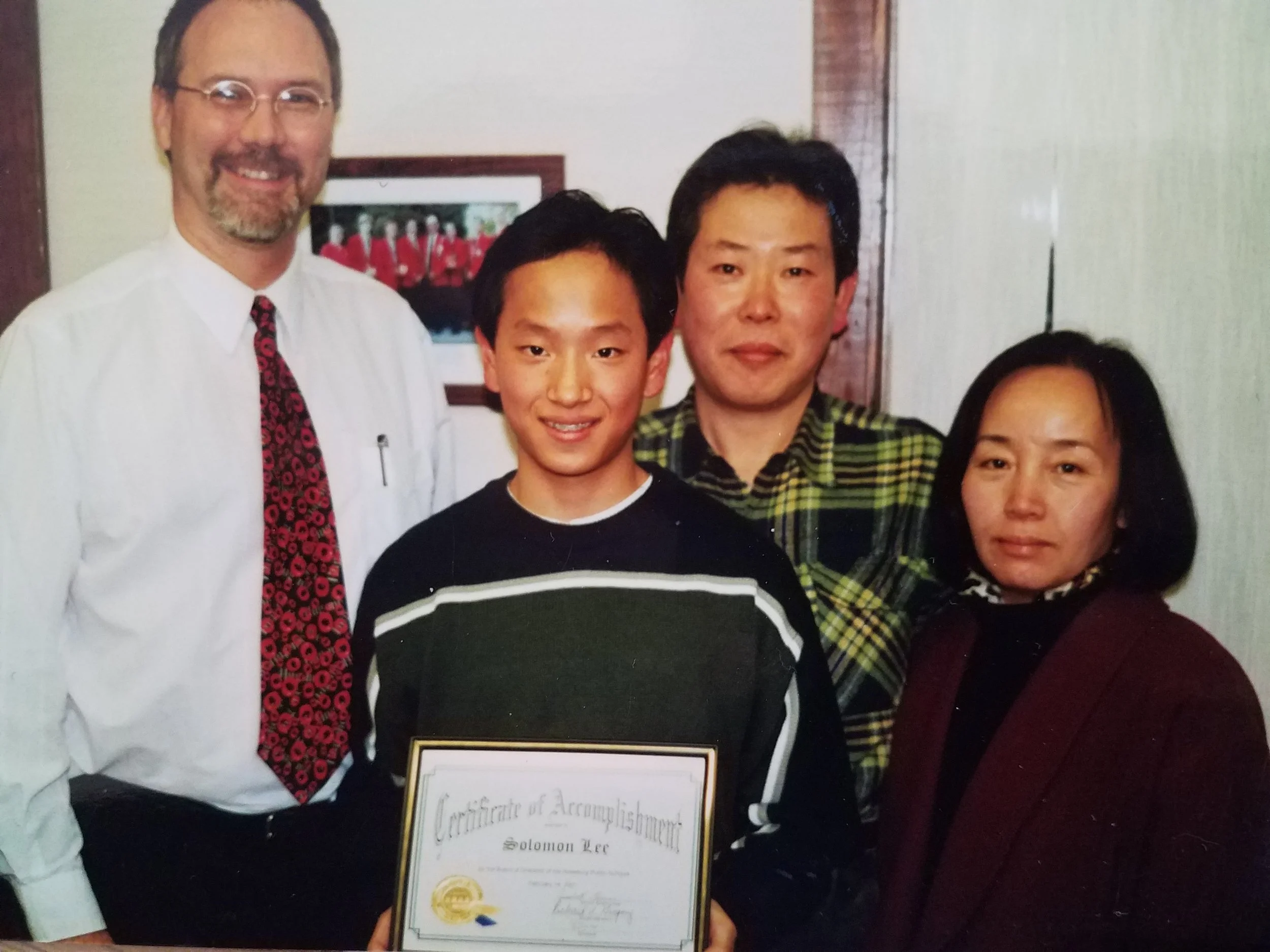 This image isn't a happy memory for me. I was 14 and I had just won a regional award as the top student in my county, but as you can guess from the flushed, angry glares on my dad's and my stepmom's faces, I had just gotten whipped before going to collect my award.