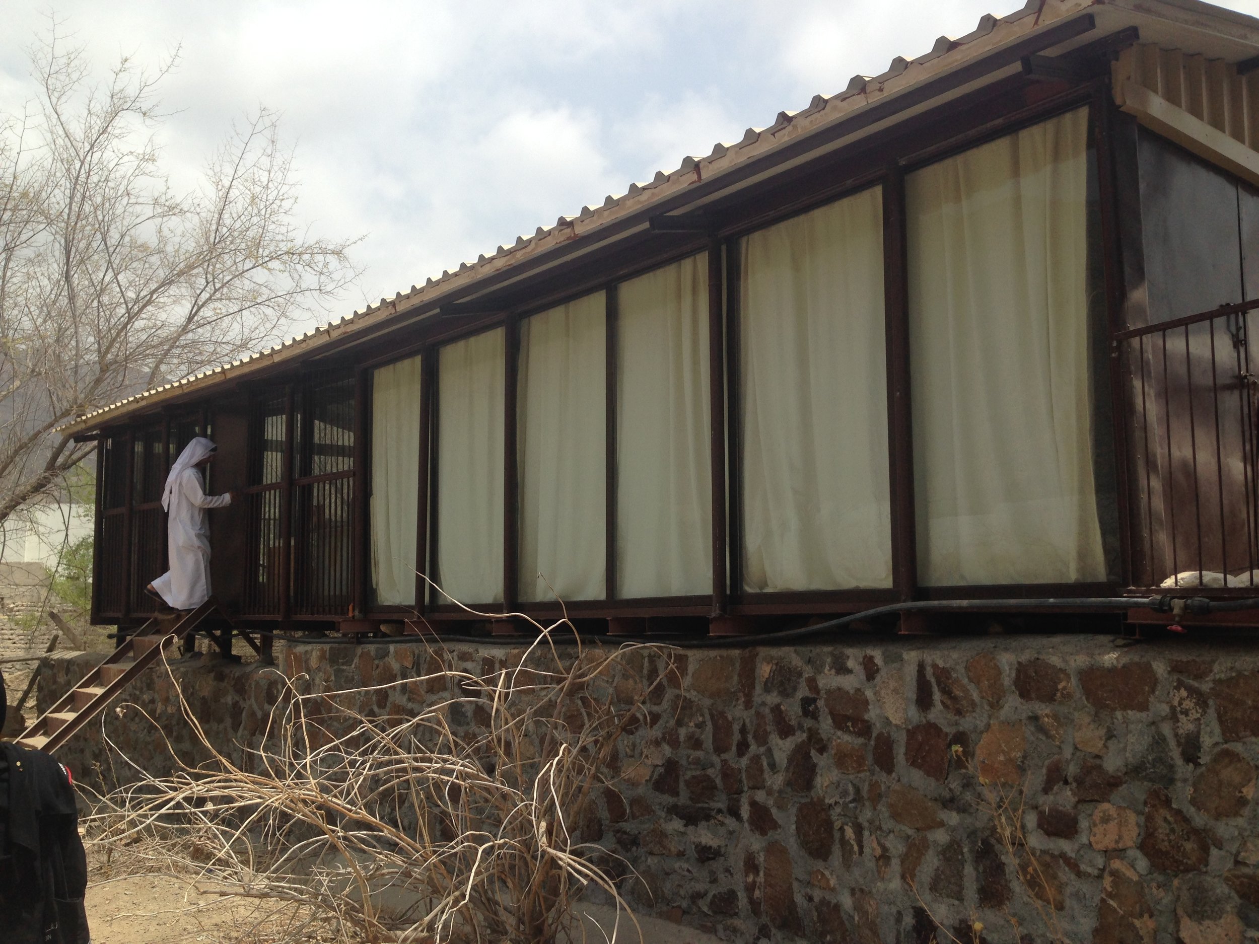 Abdullah Al Saadi enters his studio. Image by Anna Seaman