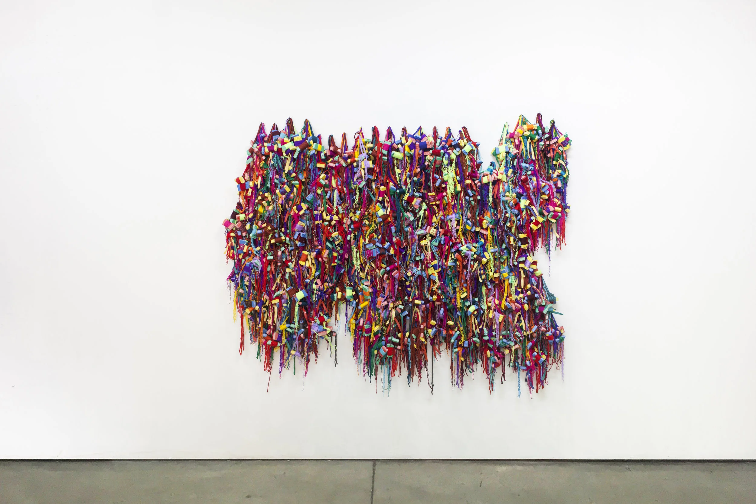 Hassan Sharif. Slippers, 2016. Slippers, wool thread and synthetic thread. 210 x 260 x 23 cm. Courtesy Estate of Hassan Sharif and Gallery Isabelle van den Eynde