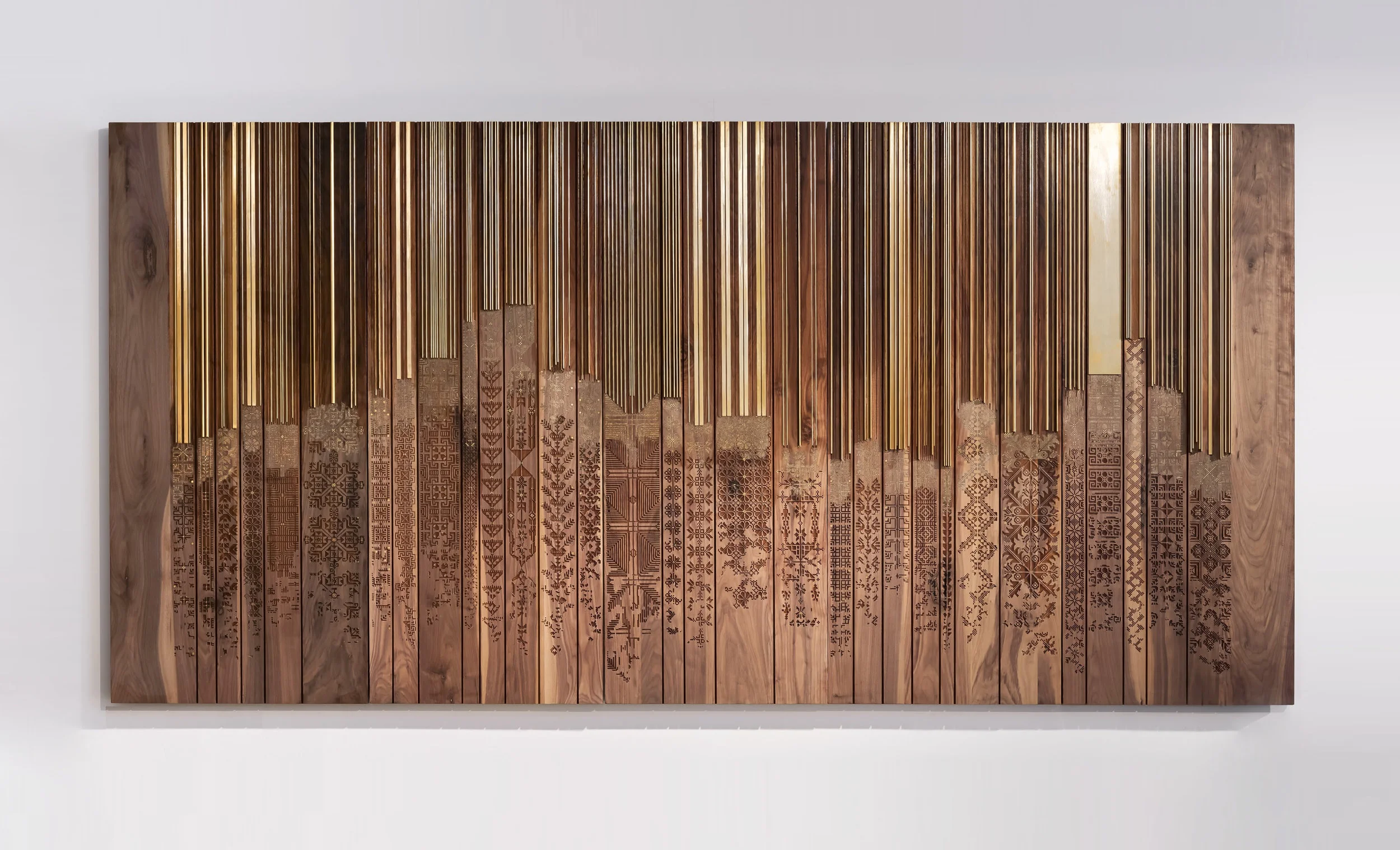 The Shawl by naqsh collective. The designers sisters Nisreen and Nermeen Abudail are Jordanian with Palestinian heritage and the design is based on Palestinian embroidery but rendered in wood and bronze. Image courtesy of the artists.