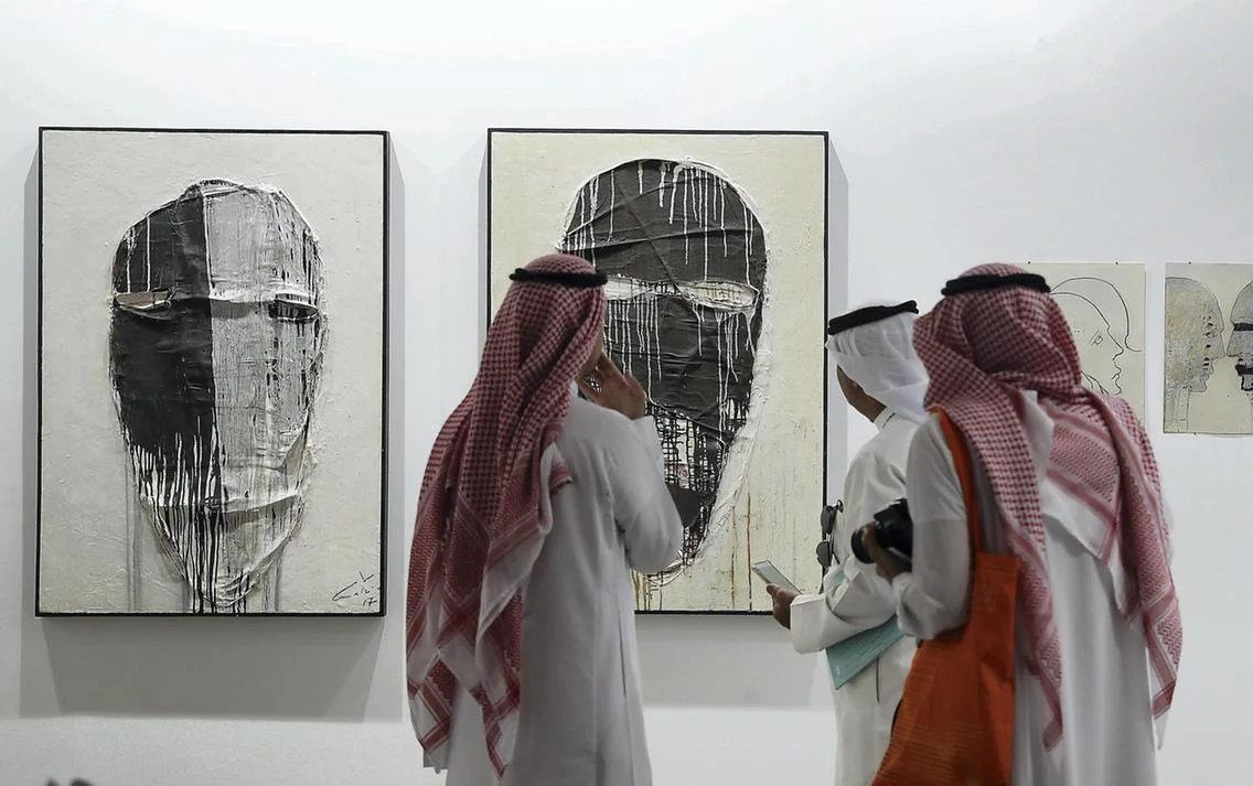 Visitors study the works on display during Art Dubai, 2017 at Madinat Jumeirah. Pawan Singh / The National