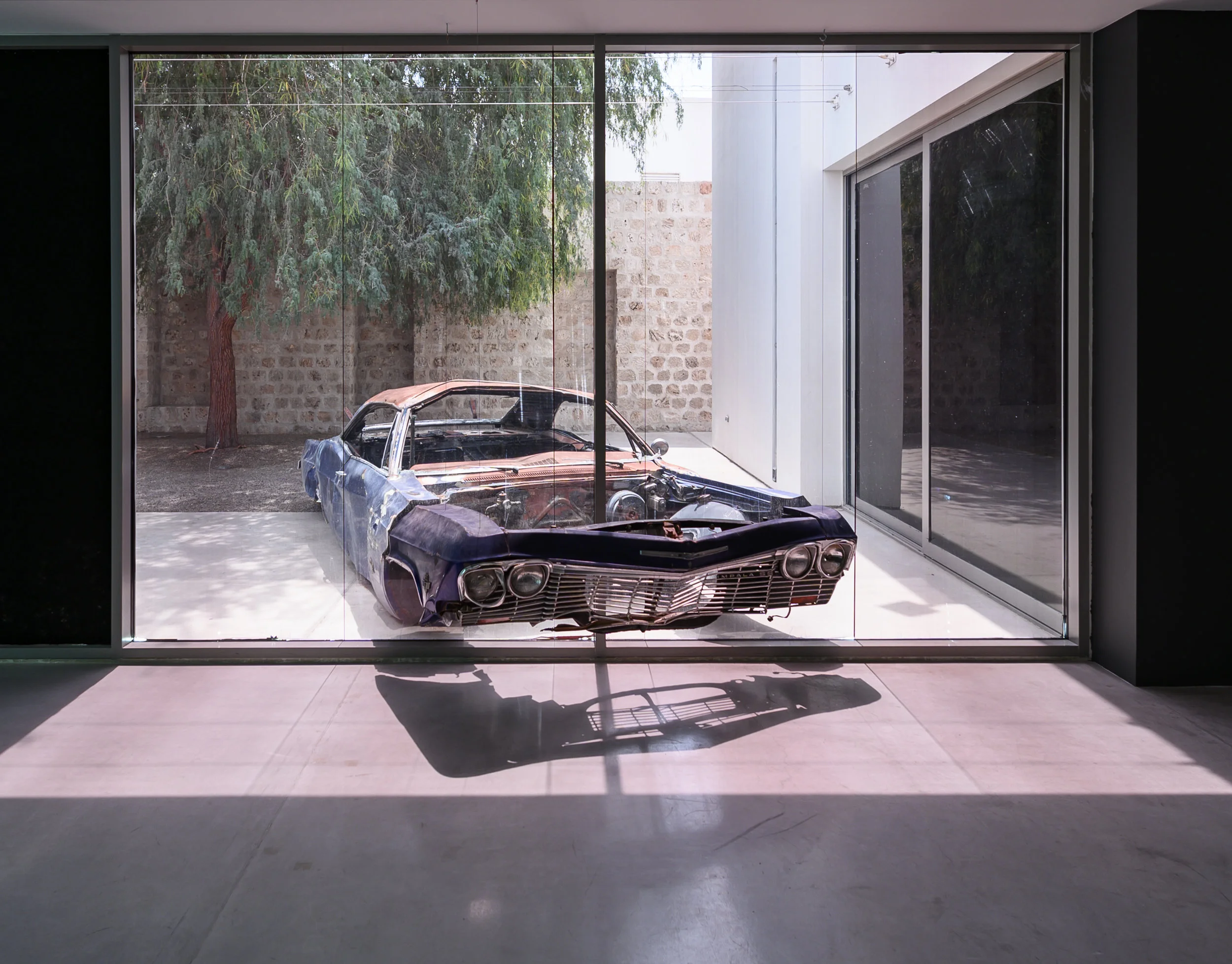 Akram Zaatari. The Landing, 2019. Film, interviews, installation, single photograph. This installation was part of Sharjah Biennial 14: Leaving the Echo Chamber. Image courtesy of Sharjah Art Foundation