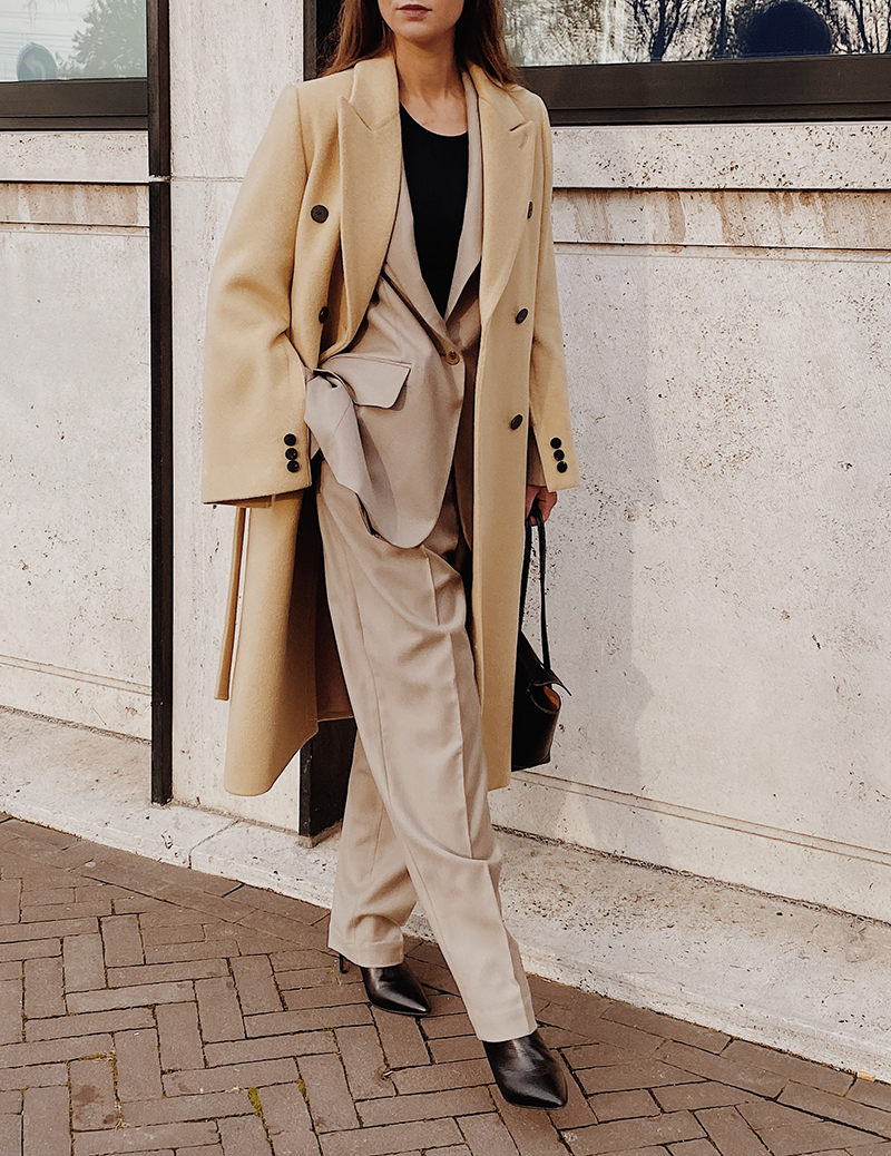 Tan ankle boots with monochrome beige suit