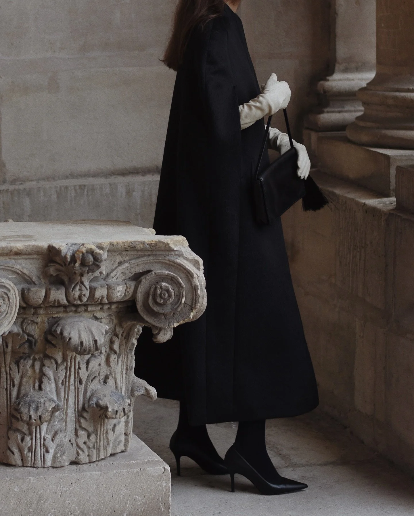 Black cape, white accents.